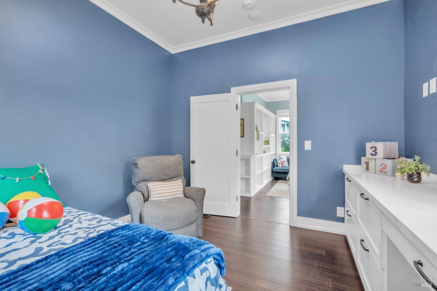 11 Jessup Street San Rafael, CA 94901 - Photo 17 of 54 a bedroom with a bed and wooden floor