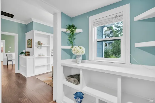 a bedroom with a bed and cabinets