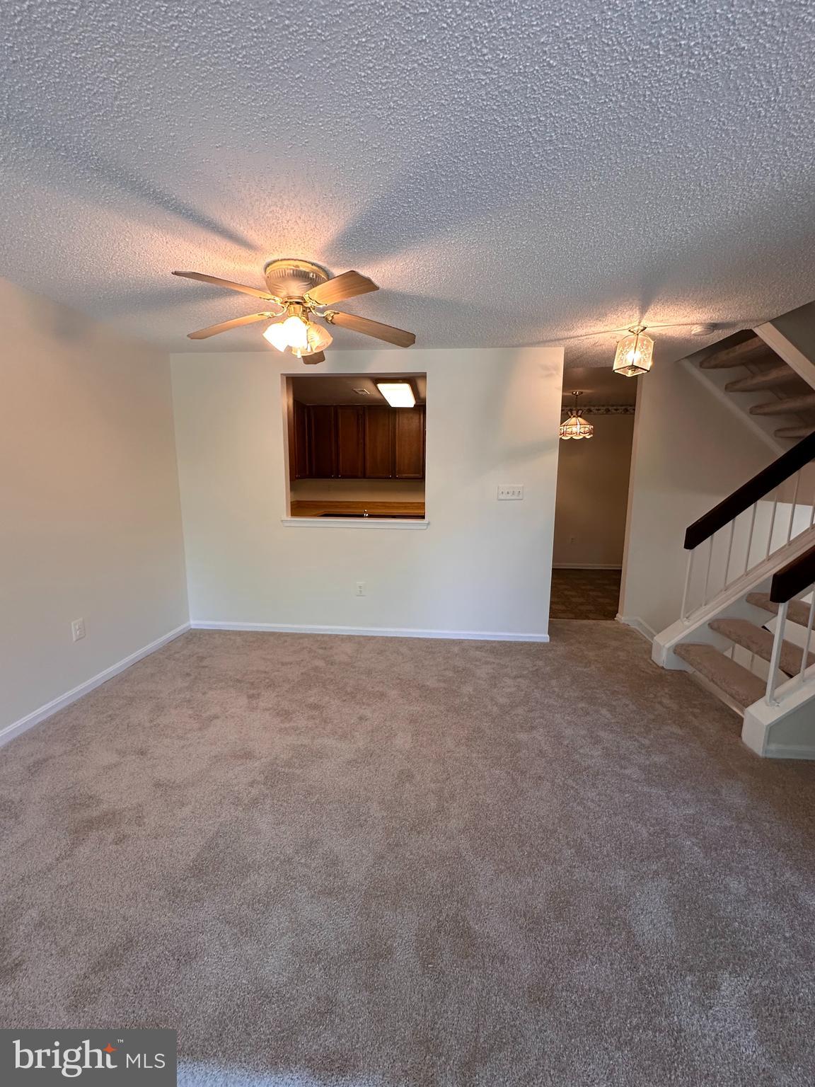 6937 Mayfair Terrace Laurel, MD 20707 - Photo 17 of 36 a view of a livingroom with a ceiling fan and window