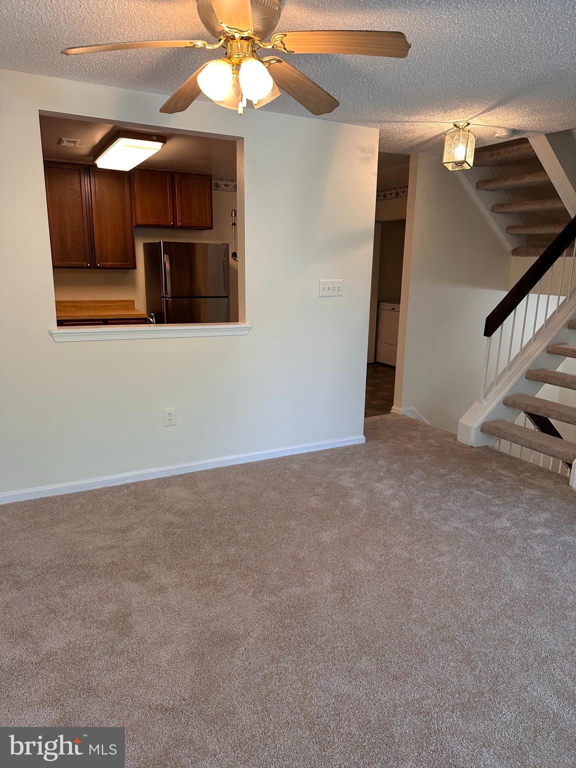 6937 Mayfair Terrace Laurel, MD 20707 - Photo 18 of 36 a view of an empty room with a ceiling fan
