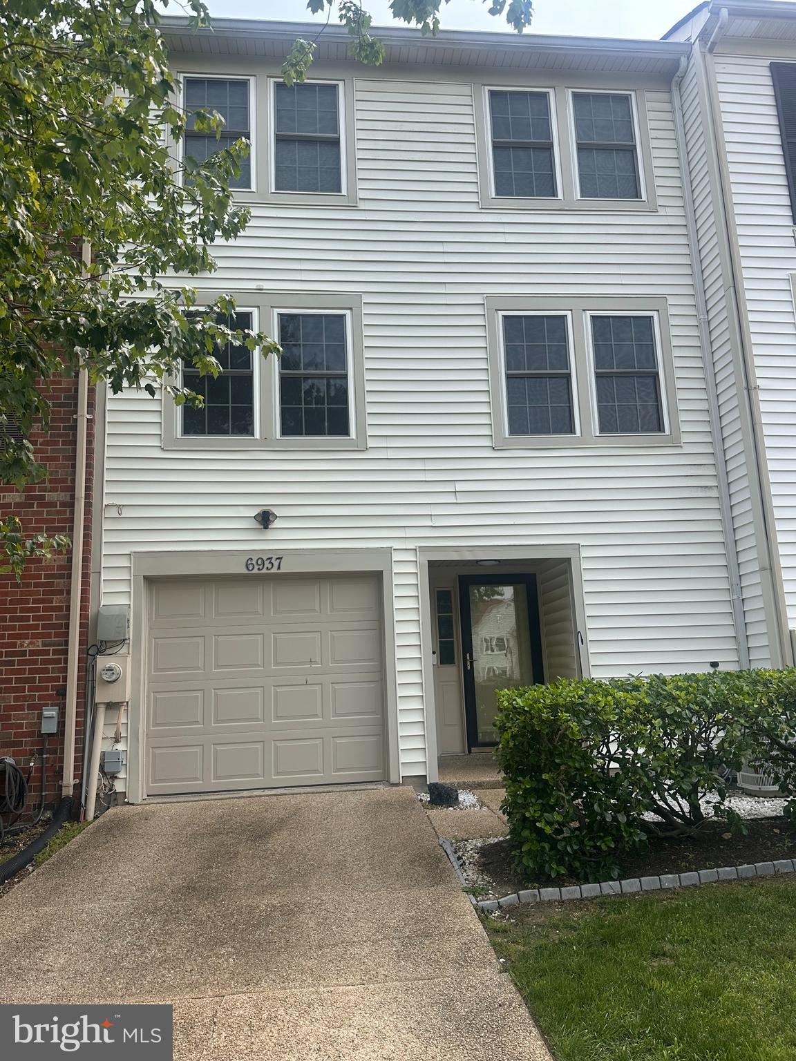 6937 Mayfair Terrace Laurel, MD 20707 - Photo 2 of 36 a front view of a house with a garage