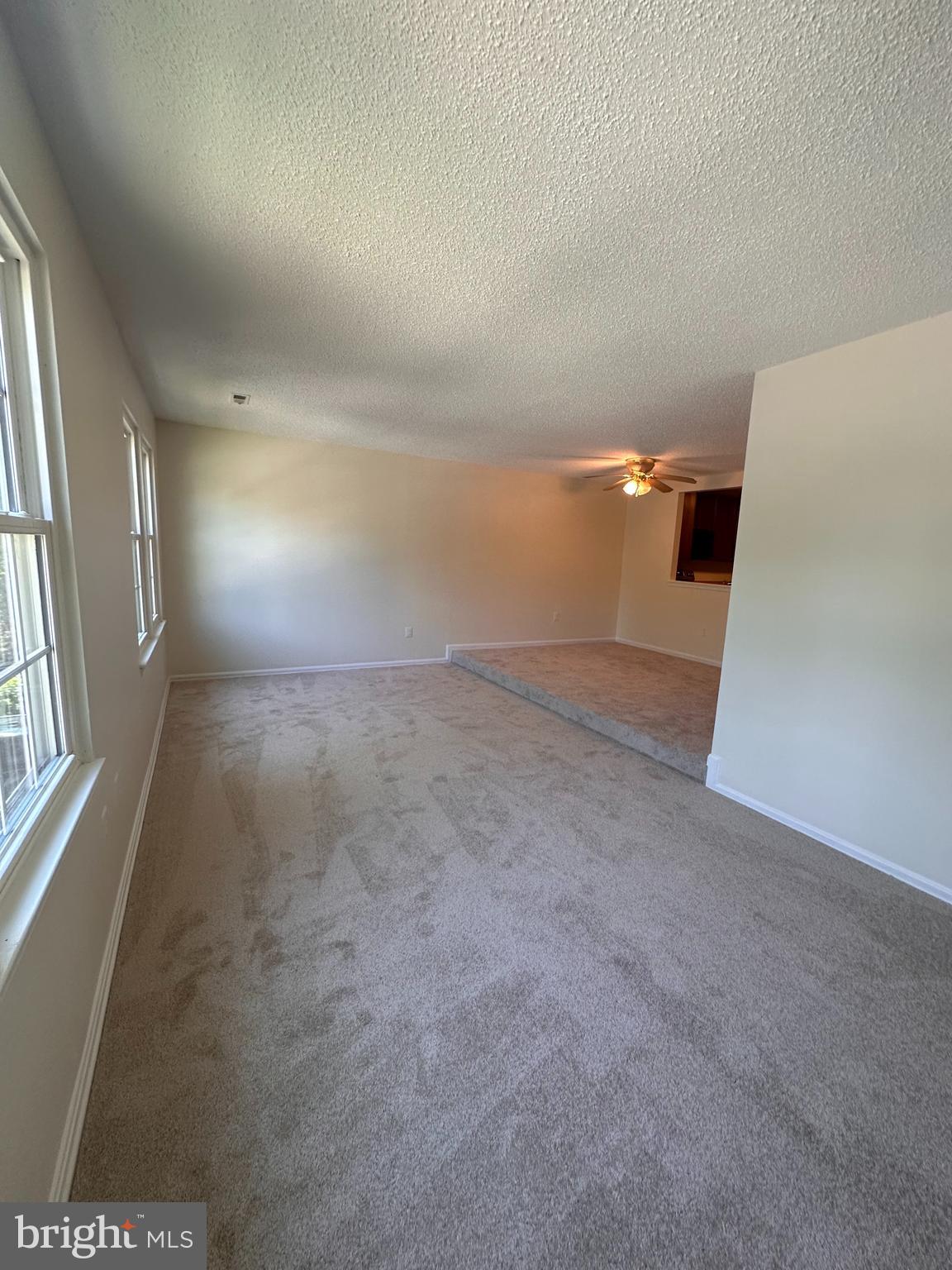 6937 Mayfair Terrace Laurel, MD 20707 - Photo 22 of 36 an empty room with windows and entrance