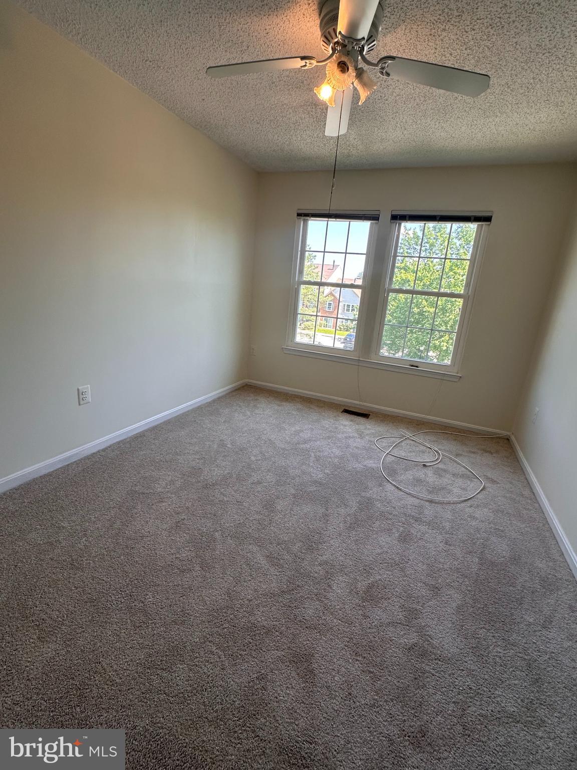 6937 Mayfair Terrace Laurel, MD 20707 - Photo 33 of 36 an empty room with a window and a fan