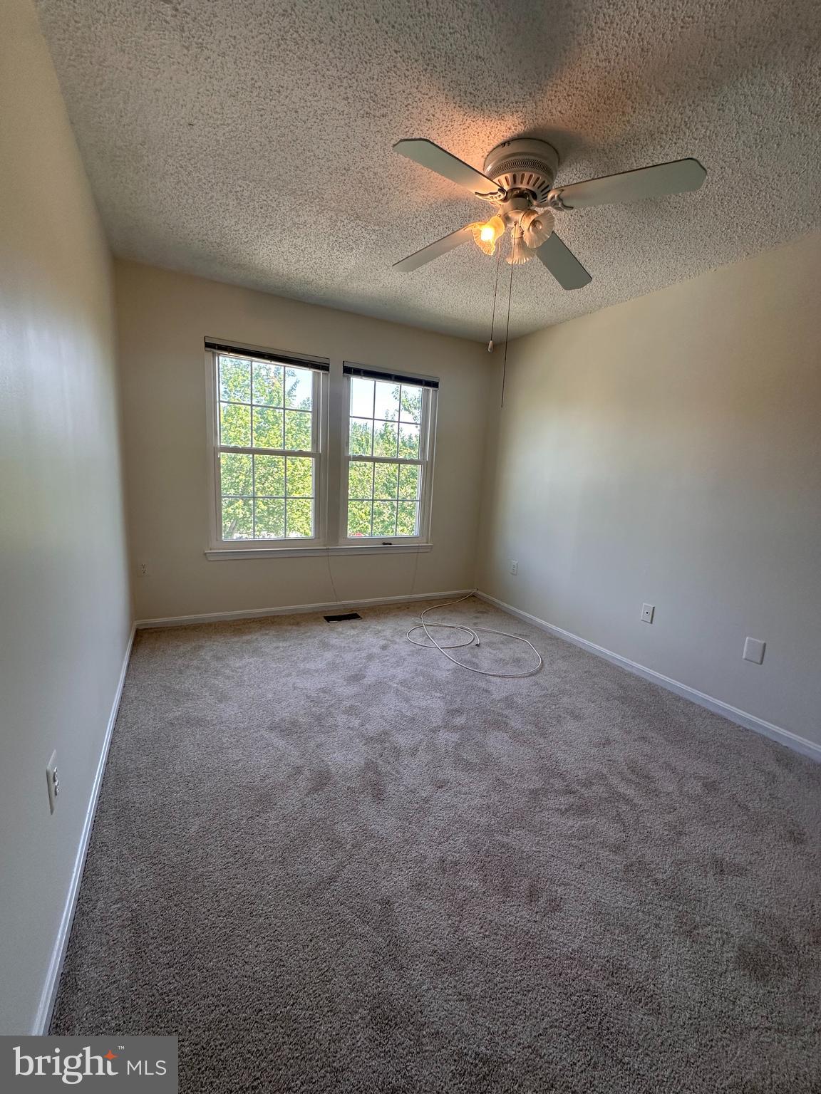 6937 Mayfair Terrace Laurel, MD 20707 - Photo 35 of 36 an empty room with windows and fan