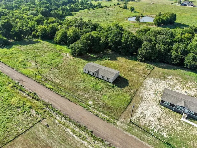 a view of a garden with a yard