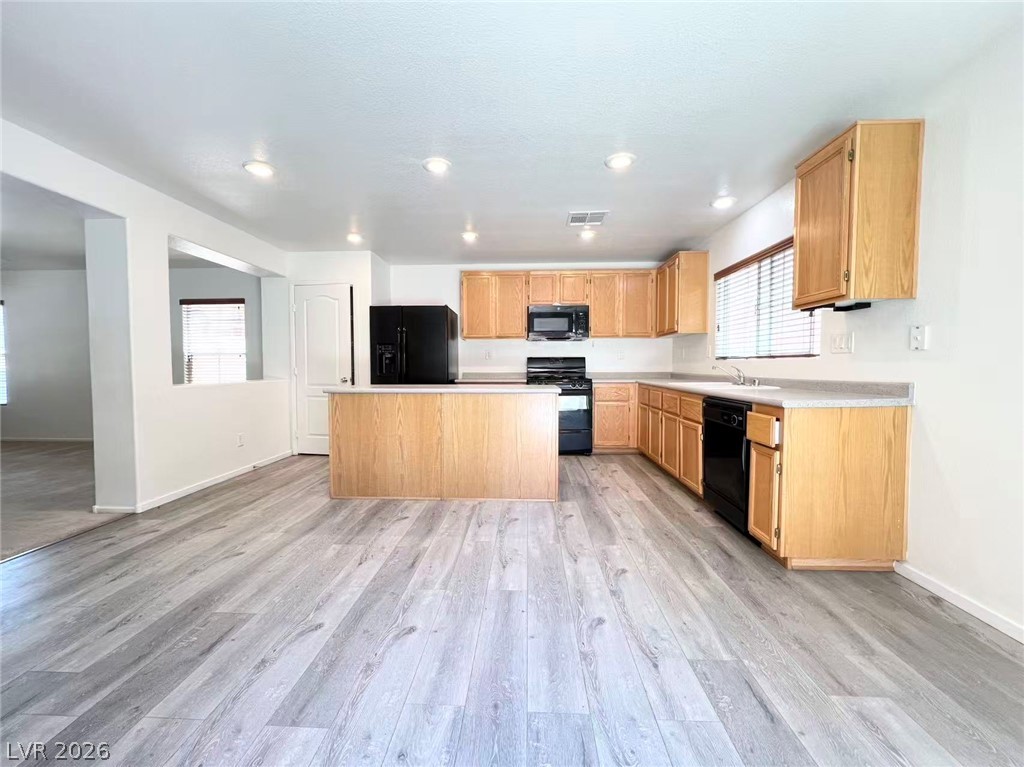11143 Ranch Valley Street Las Vegas, NV 89179 - Photo 7 of 23 A streamlined kitchen offering abundant storage and a practical, open-concept design.