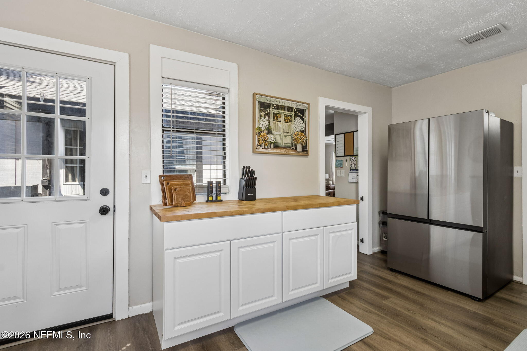 4816 Riverdale Road Jacksonville, FL 32210 - Photo 11 of 49 a kitchen with stainless steel appliances granite countertop a refrigerator and a sink