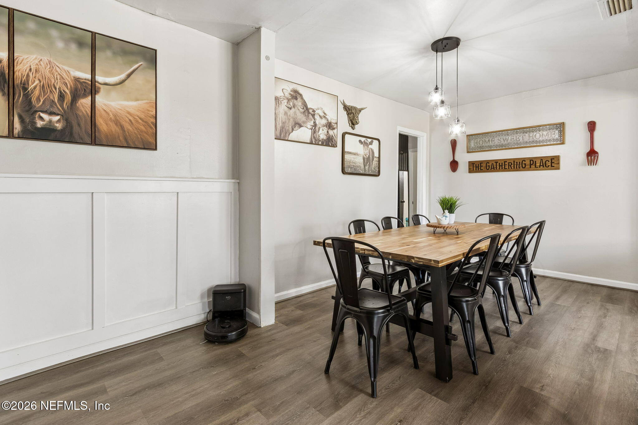 4816 Riverdale Road Jacksonville, FL 32210 - Photo 14 of 49 a view of a dining room with furniture and wooden floor