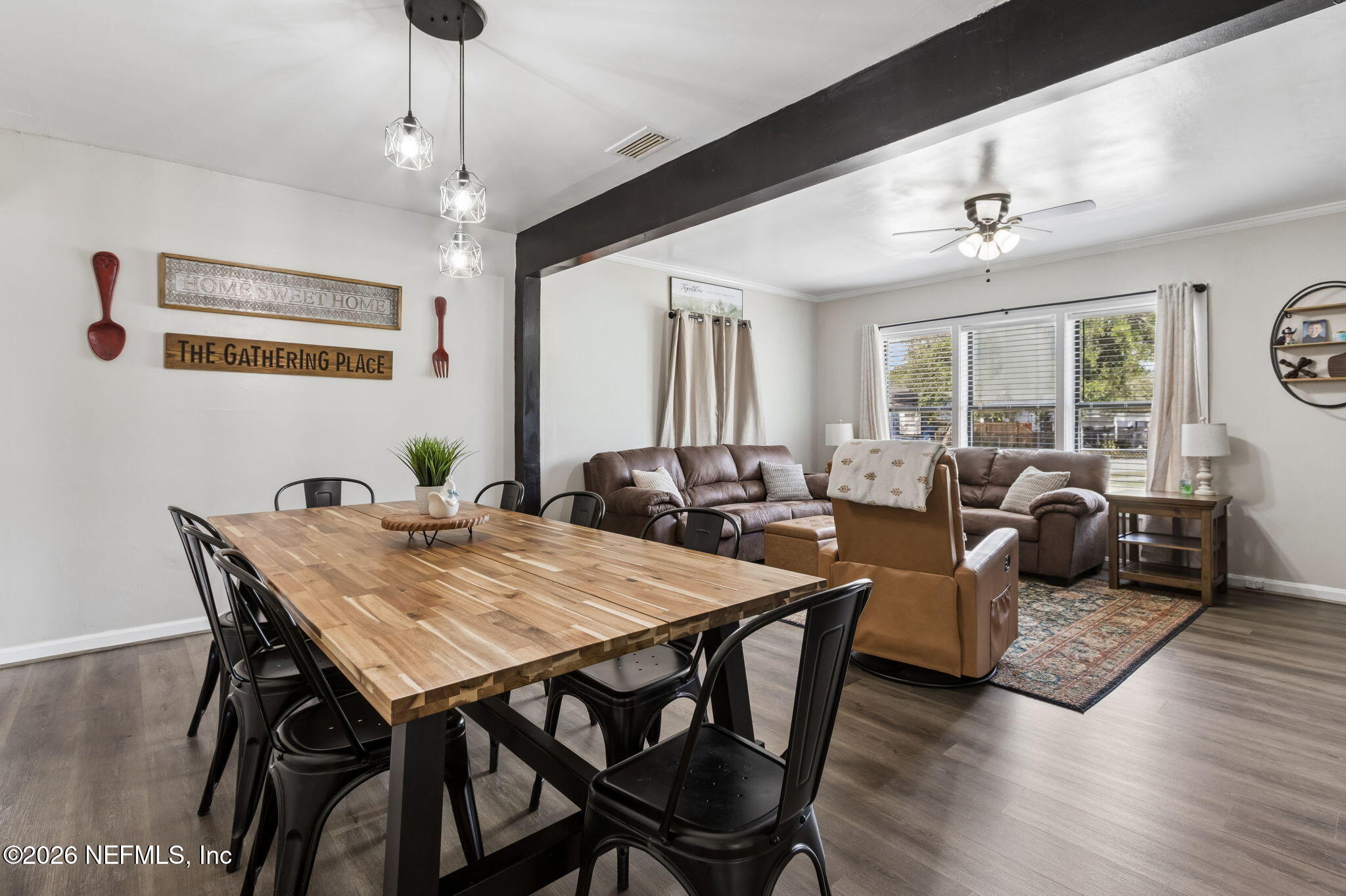 4816 Riverdale Road Jacksonville, FL 32210 - Photo 15 of 49 a view of a dining room with furniture window and wooden floor