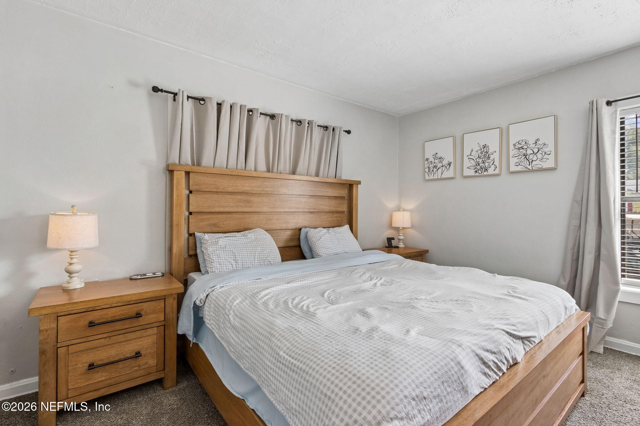 4816 Riverdale Road Jacksonville, FL 32210 - Photo 16 of 49 a bedroom with a bed and a window