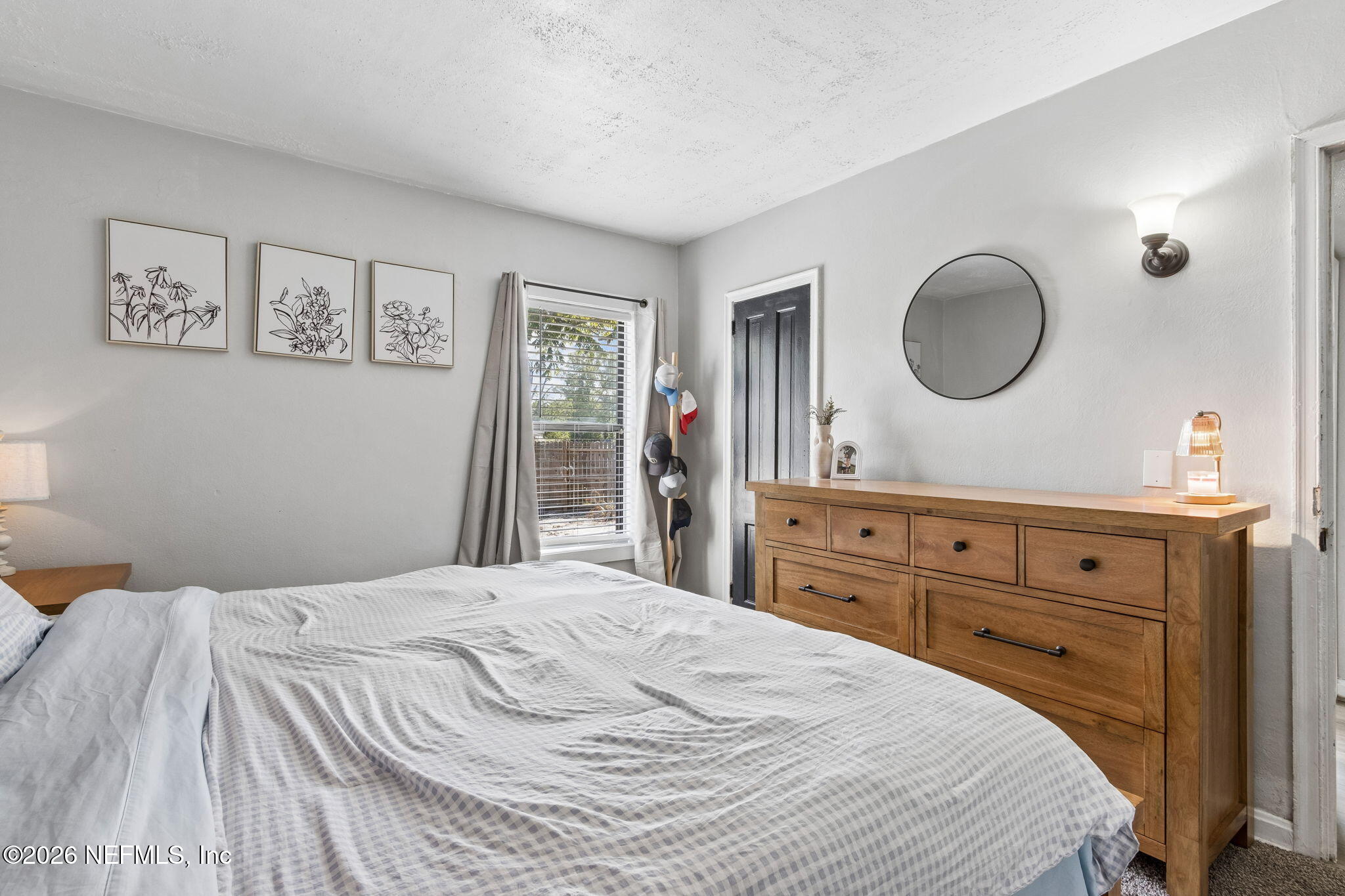 4816 Riverdale Road Jacksonville, FL 32210 - Photo 17 of 49 a bedroom with a sink and a mirror