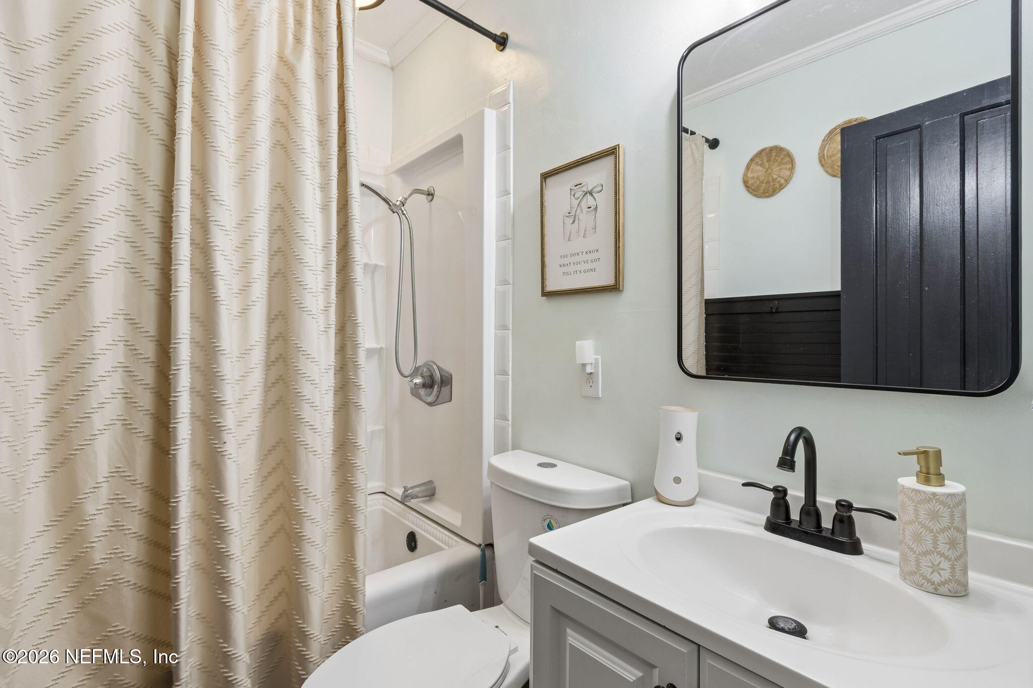 4816 Riverdale Road Jacksonville, FL 32210 - Photo 20 of 49 a bathroom with a sink a toilet and shower