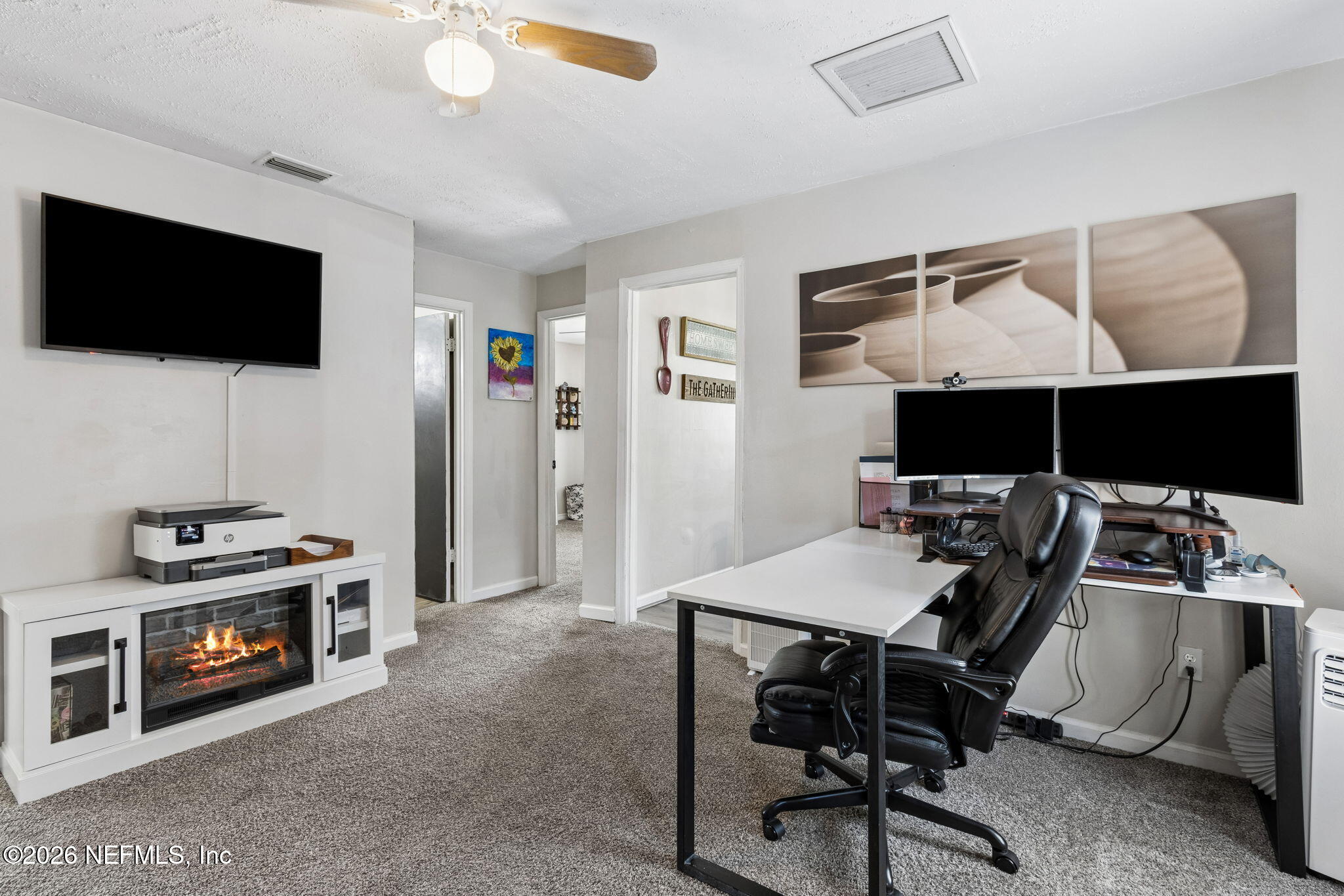 4816 Riverdale Road Jacksonville, FL 32210 - Photo 26 of 49 a view of a livingroom with furniture and a flat screen tv