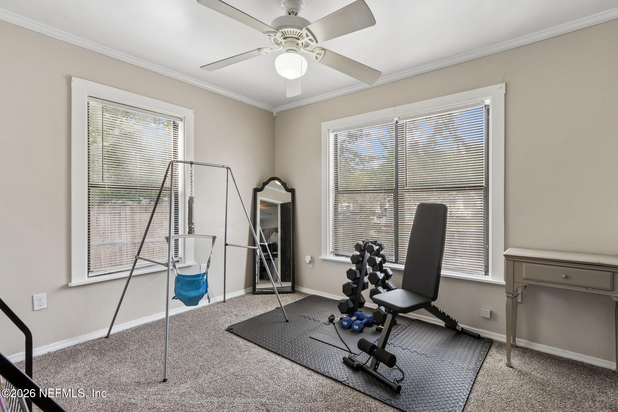 4816 Riverdale Road Jacksonville, FL 32210 - Photo 29 of 49 a view of a workspace with furniture and a window