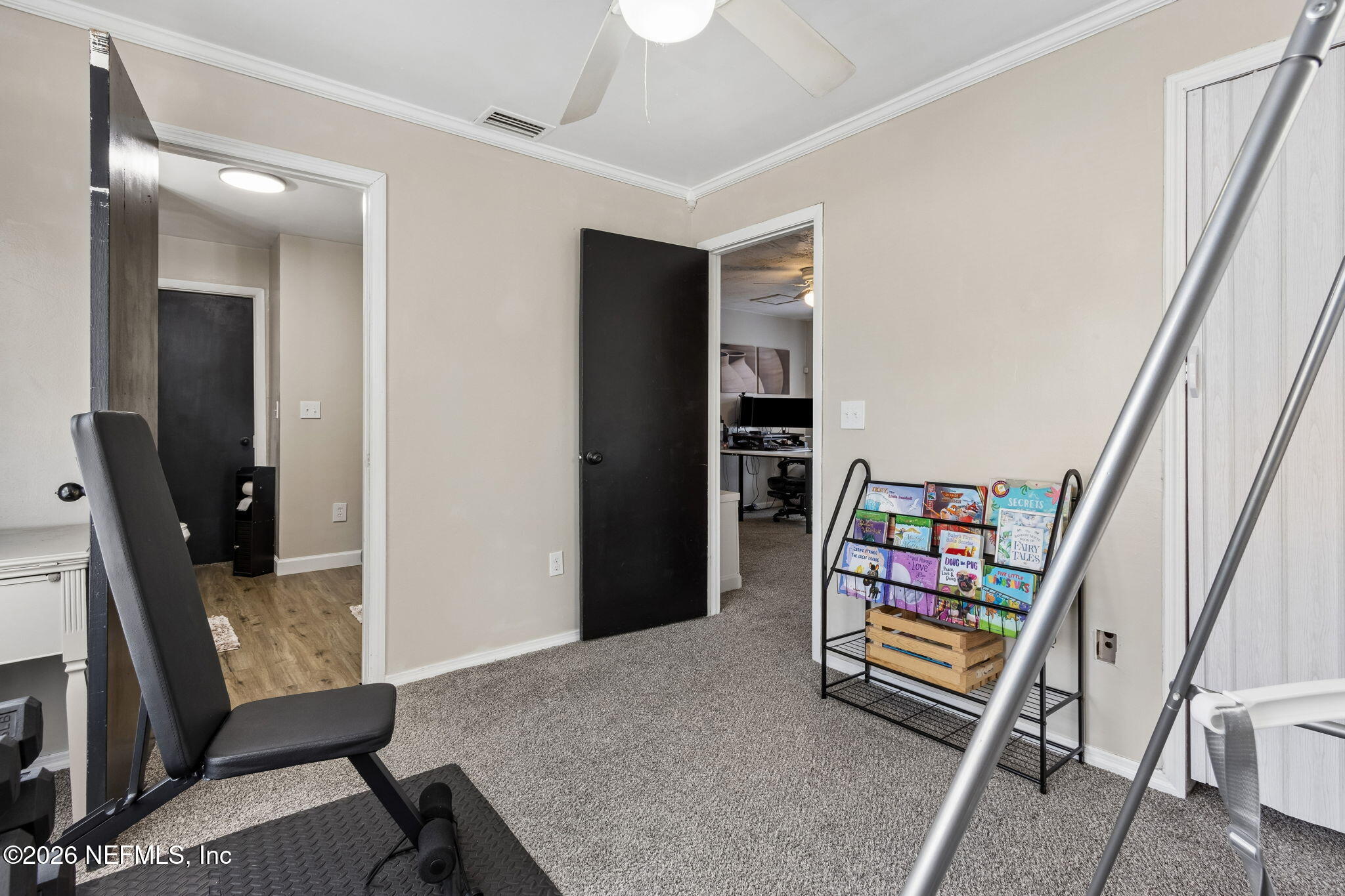 4816 Riverdale Road Jacksonville, FL 32210 - Photo 30 of 49 a room with furniture and a flat screen tv