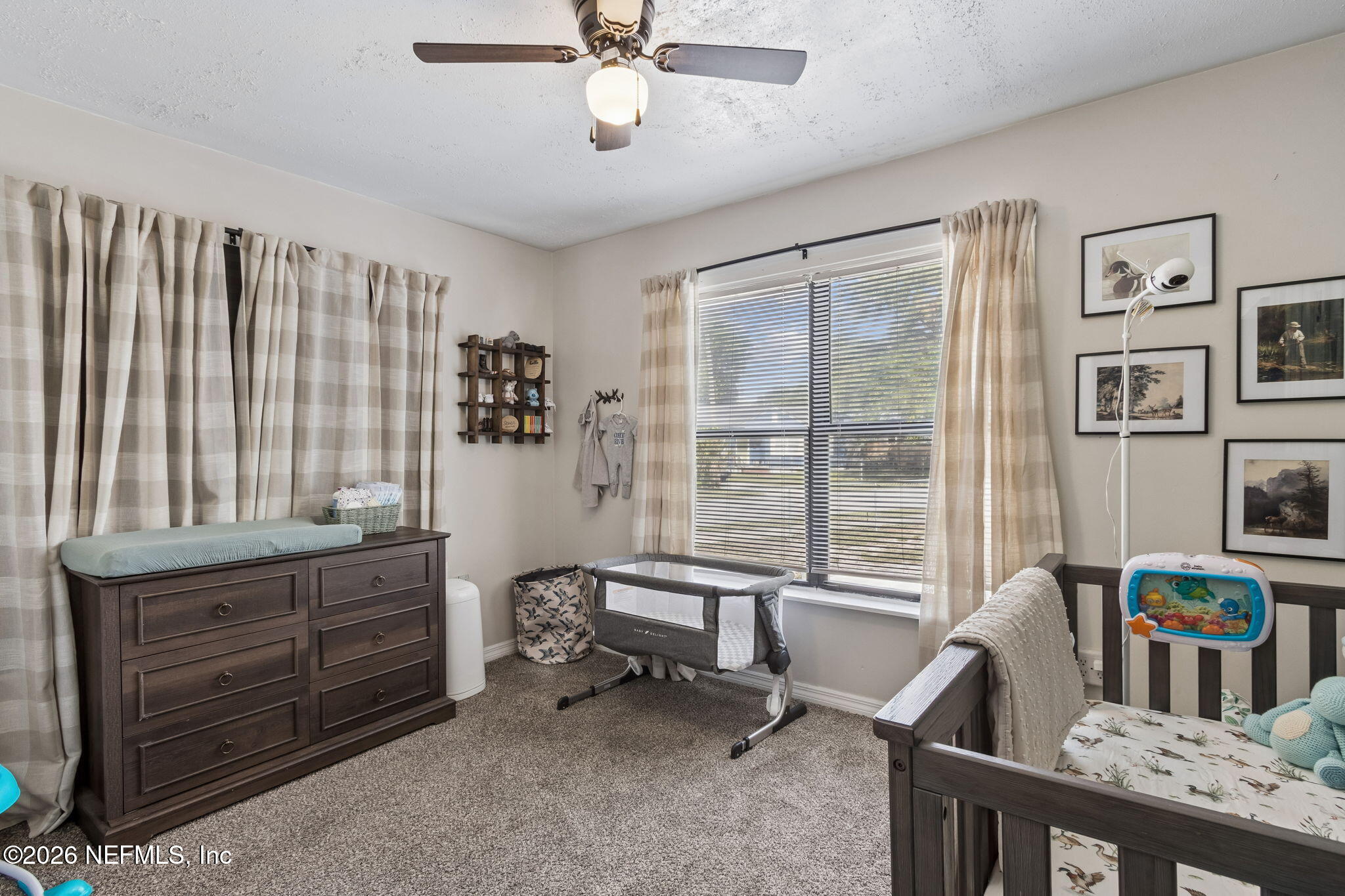 4816 Riverdale Road Jacksonville, FL 32210 - Photo 32 of 49 a living room with furniture and a window