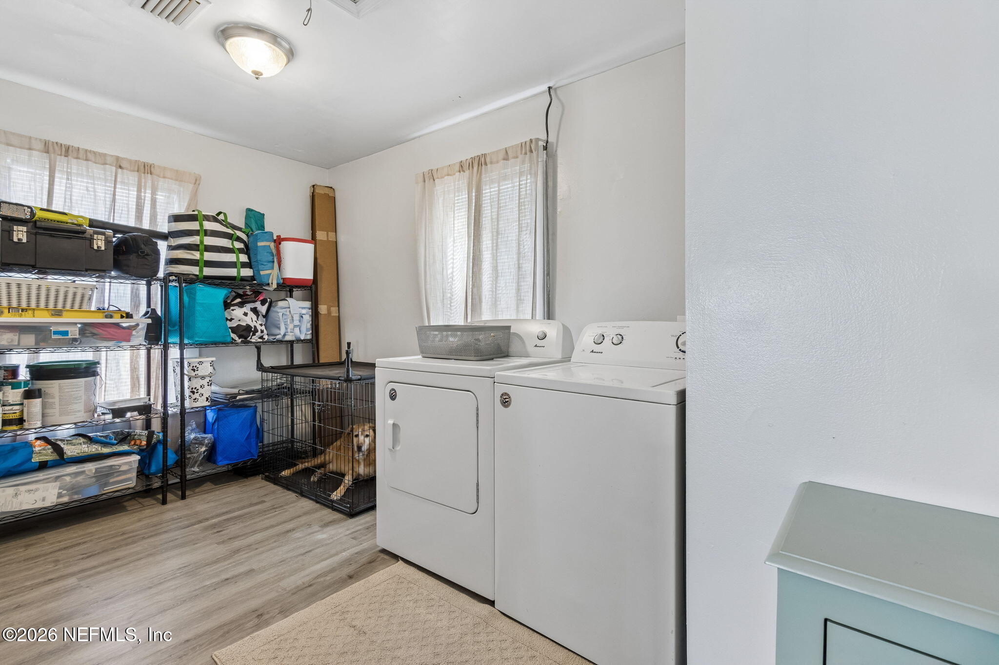 4816 Riverdale Road Jacksonville, FL 32210 - Photo 34 of 49 a view of storage and utility room with washer and dryer