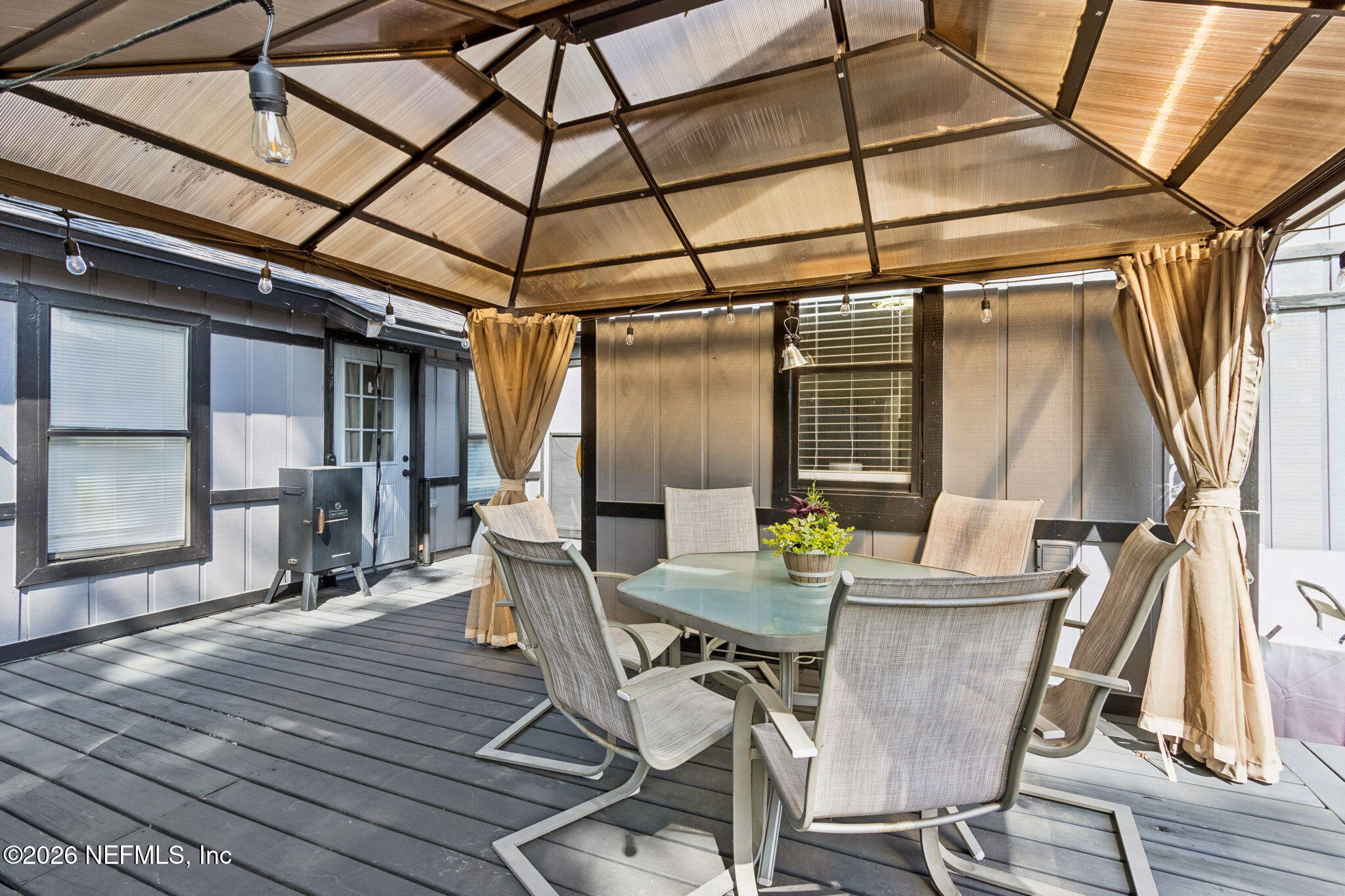 4816 Riverdale Road Jacksonville, FL 32210 - Photo 37 of 49 a view of a dining room with furniture wooden floor and a rug