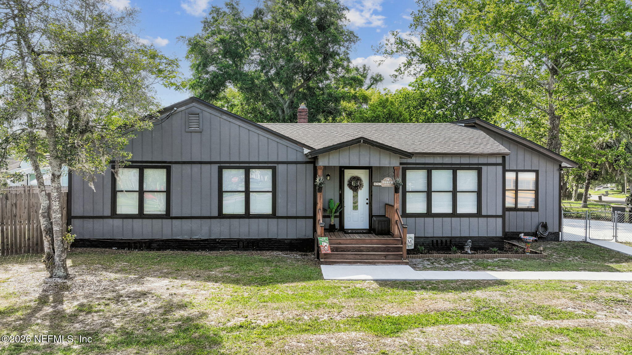 4816 Riverdale Road Jacksonville, FL 32210 - Photo 46 of 49 a front view of a house with a yard