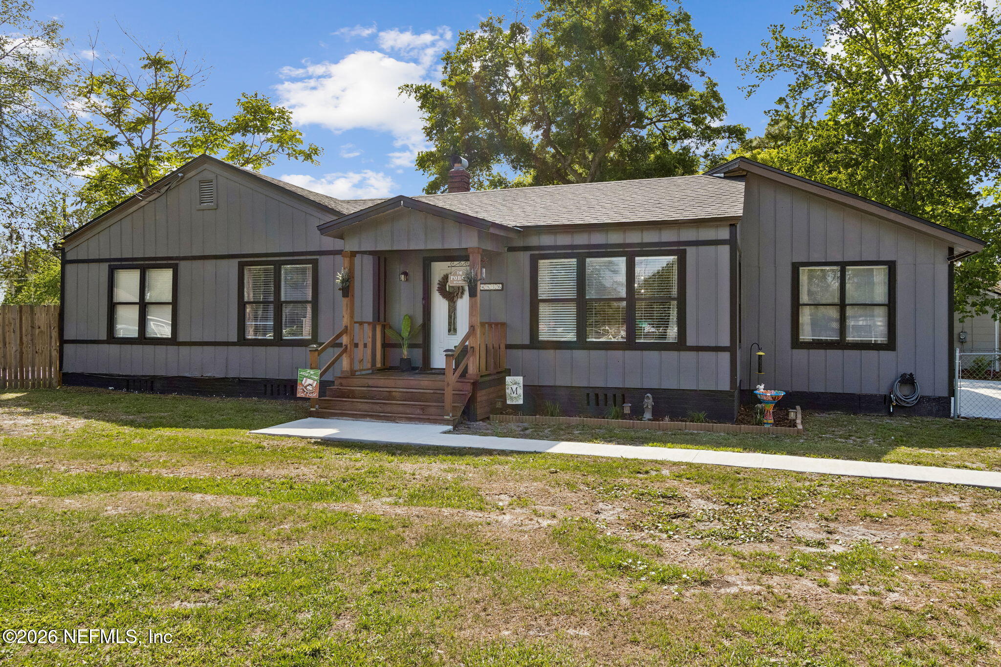 4816 Riverdale Road Jacksonville, FL 32210 - Photo 49 of 49 a view of a house with swimming pool next to a yard