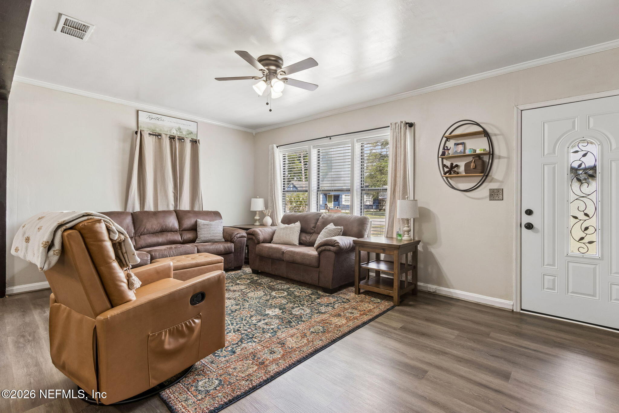 4816 Riverdale Road Jacksonville, FL 32210 - Photo 6 of 49 a living room with furniture and wooden floor
