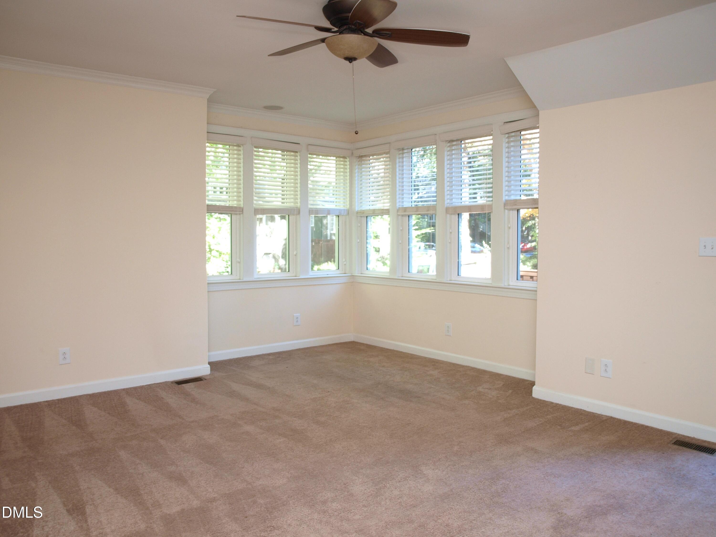 1707 Falls Church Road Raleigh, NC 27609 - Photo 4 of 22 a view of an empty room with a window