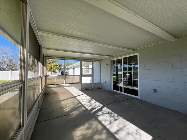 a view of a big room with windows