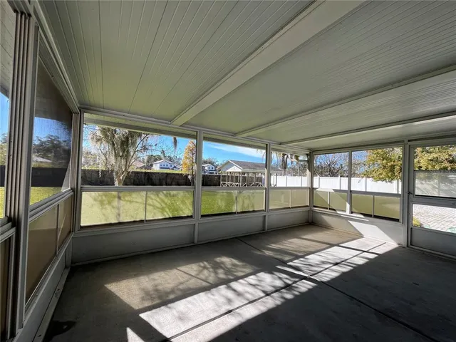 a view of an empty room with a large window