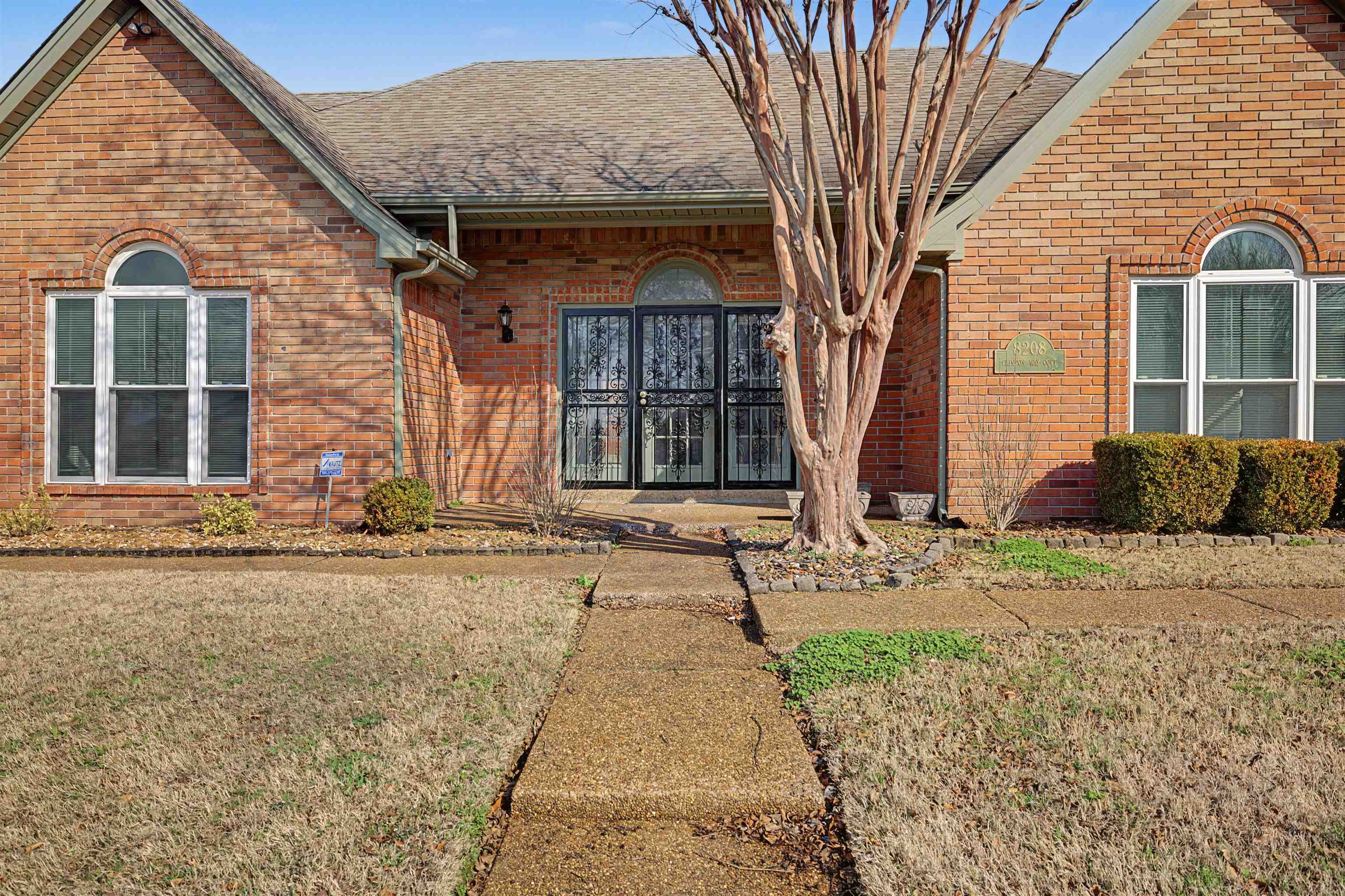 8208 Clinton Way Cove Memphis, TN 38018 - Photo 2 of 31 a front view of a house with garden