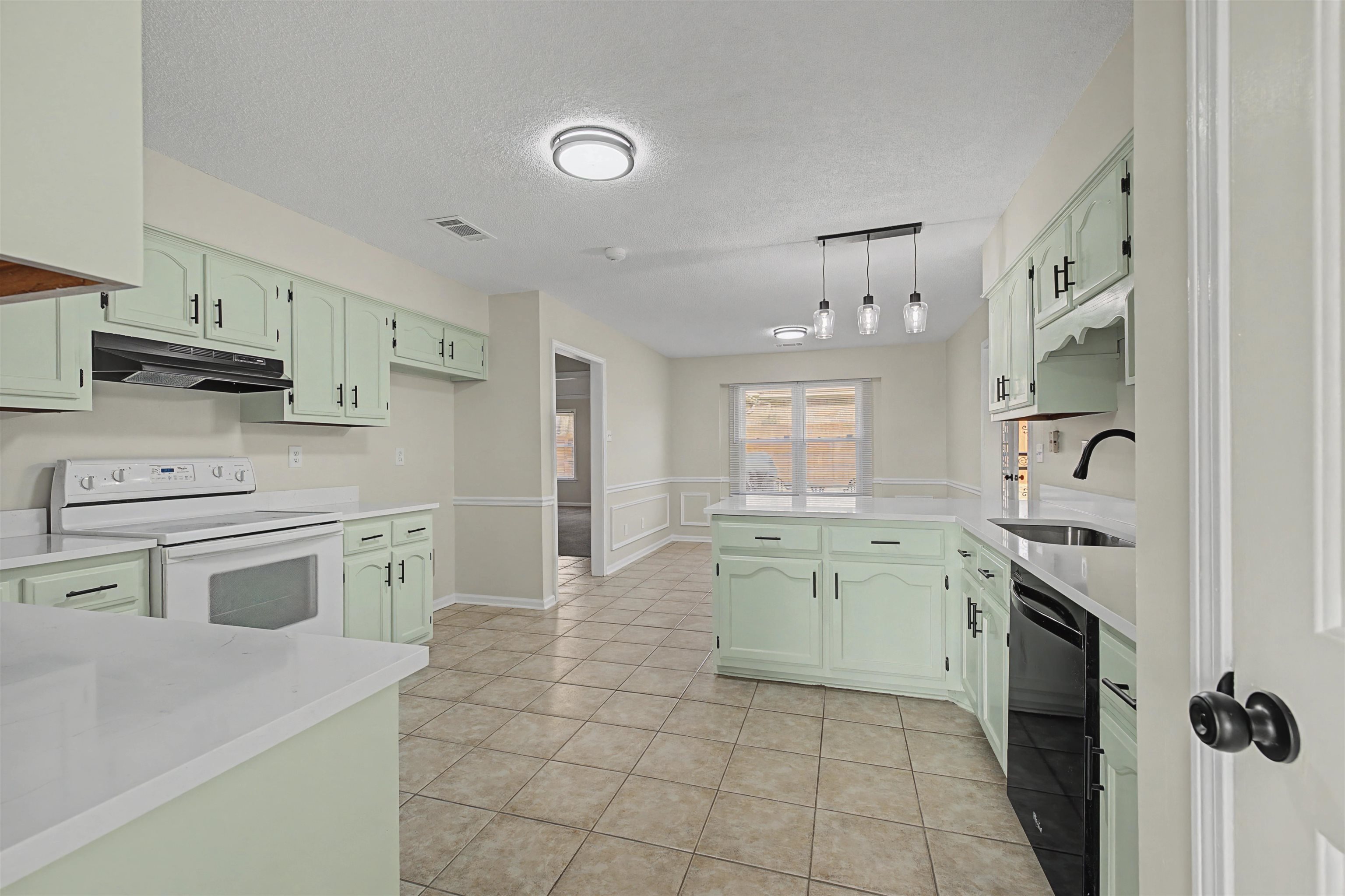 8208 Clinton Way Cove Memphis, TN 38018 - Photo 4 of 31 a kitchen with a stove a sink and a refrigerator