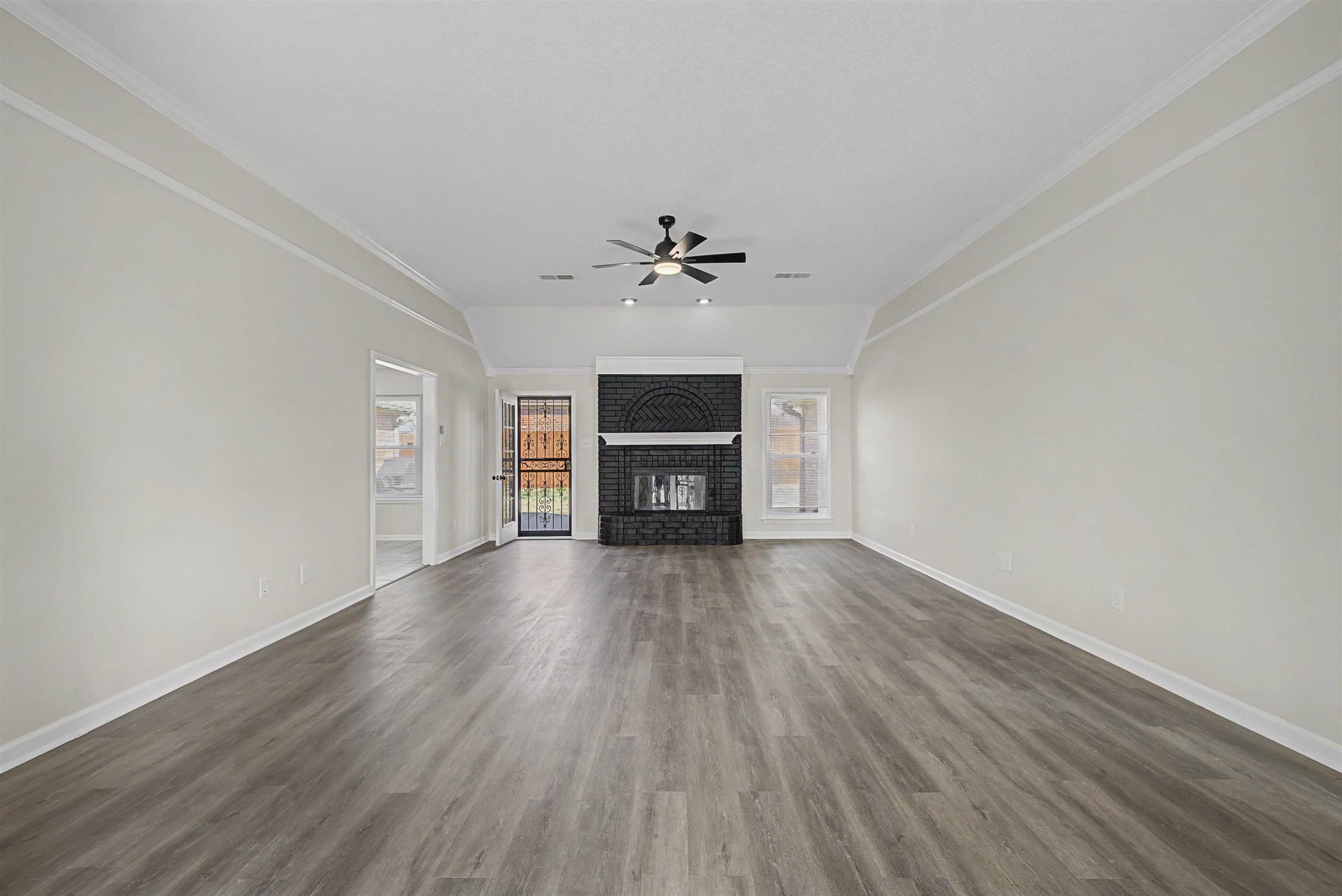 8208 Clinton Way Cove Memphis, TN 38018 - Photo 8 of 31 wooden floor in an empty room with a window