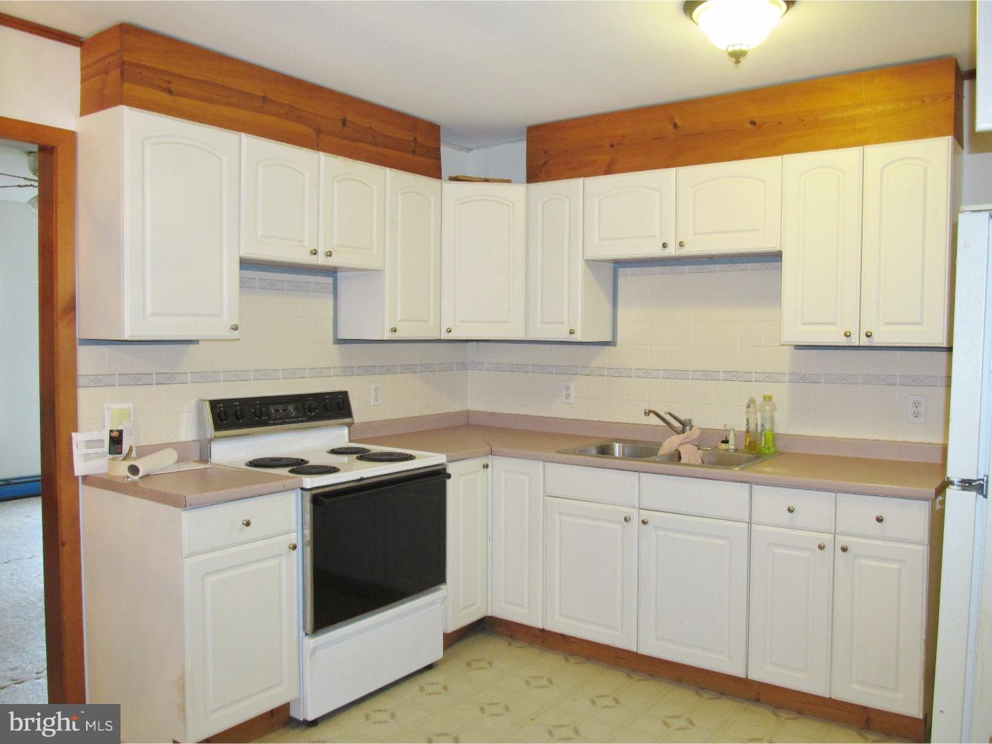 12 Scrapetown Road Pemberton, NJ 08068 - Photo 4 of 11 a kitchen with a sink a stove and cabinets