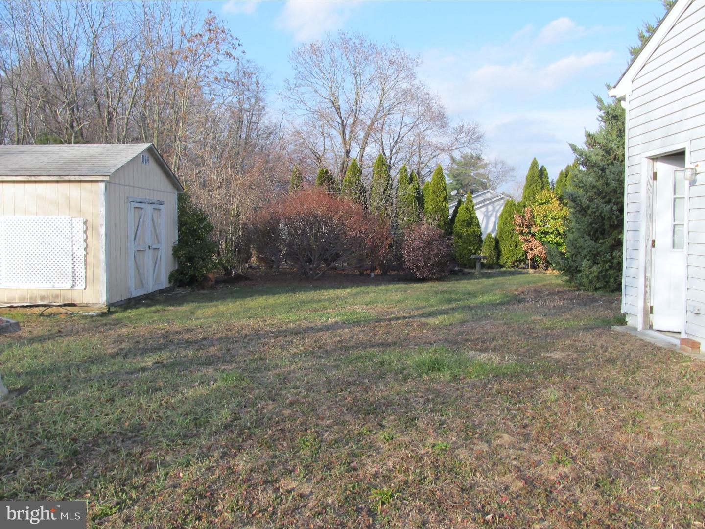 12 Scrapetown Road Pemberton, NJ 08068 - Photo 9 of 11 a view of a backyard with large trees