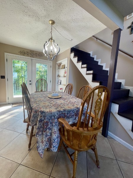 460 Mate Allen Road Gainesboro, TN 38562 - Photo 21 of 49 a dining room with furniture a chandelier and wooden floor