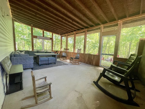 460 Mate Allen Road Gainesboro, TN 38562 - Photo 30 of 49 a living room with furniture a fireplace and large windows