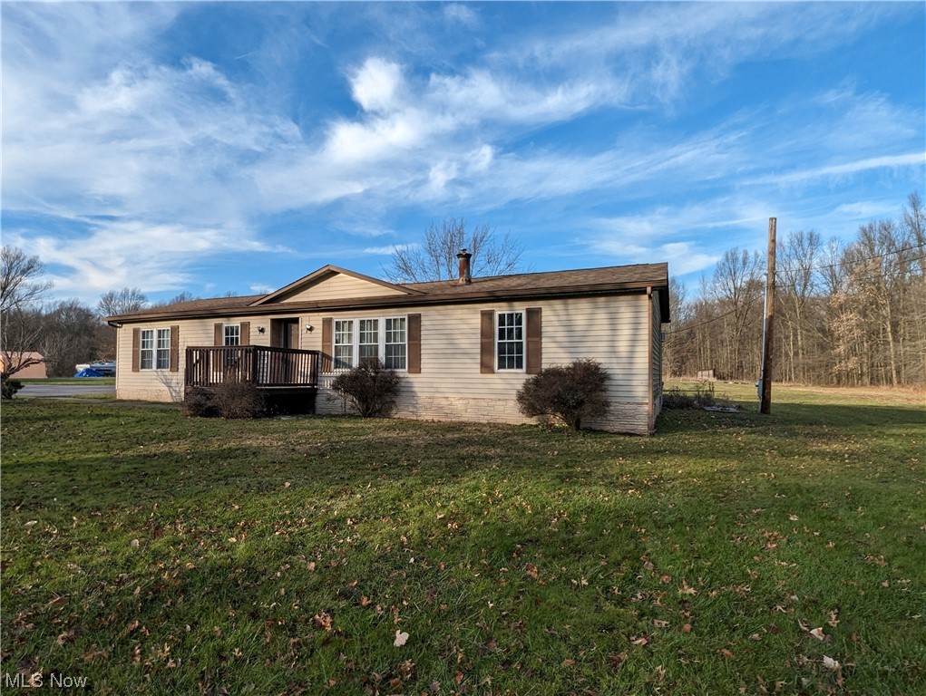 10267 Cable Line Road Newton Falls, OH 44444 - Photo 24 of 33 View of front facade featuring a front yard and a wooden deck