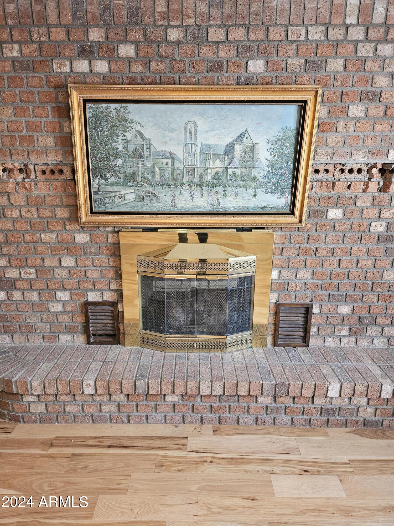 948 East Grandview Road Phoenix, AZ 85022 - Photo 20 of 43 a view of a fireplace with wooden floor