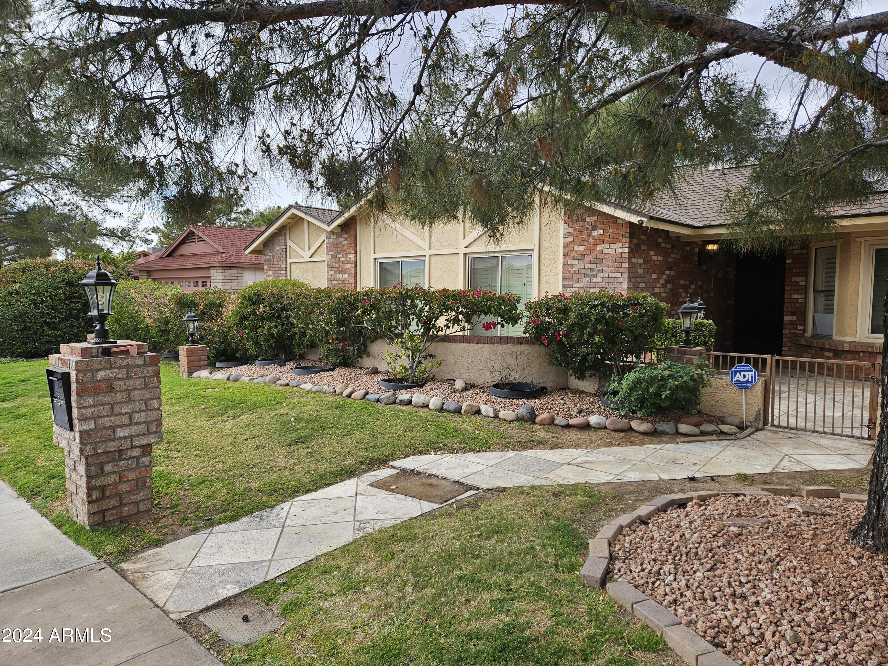 948 East Grandview Road Phoenix, AZ 85022 - Photo 2 of 43 a front view of a house with yard and green space