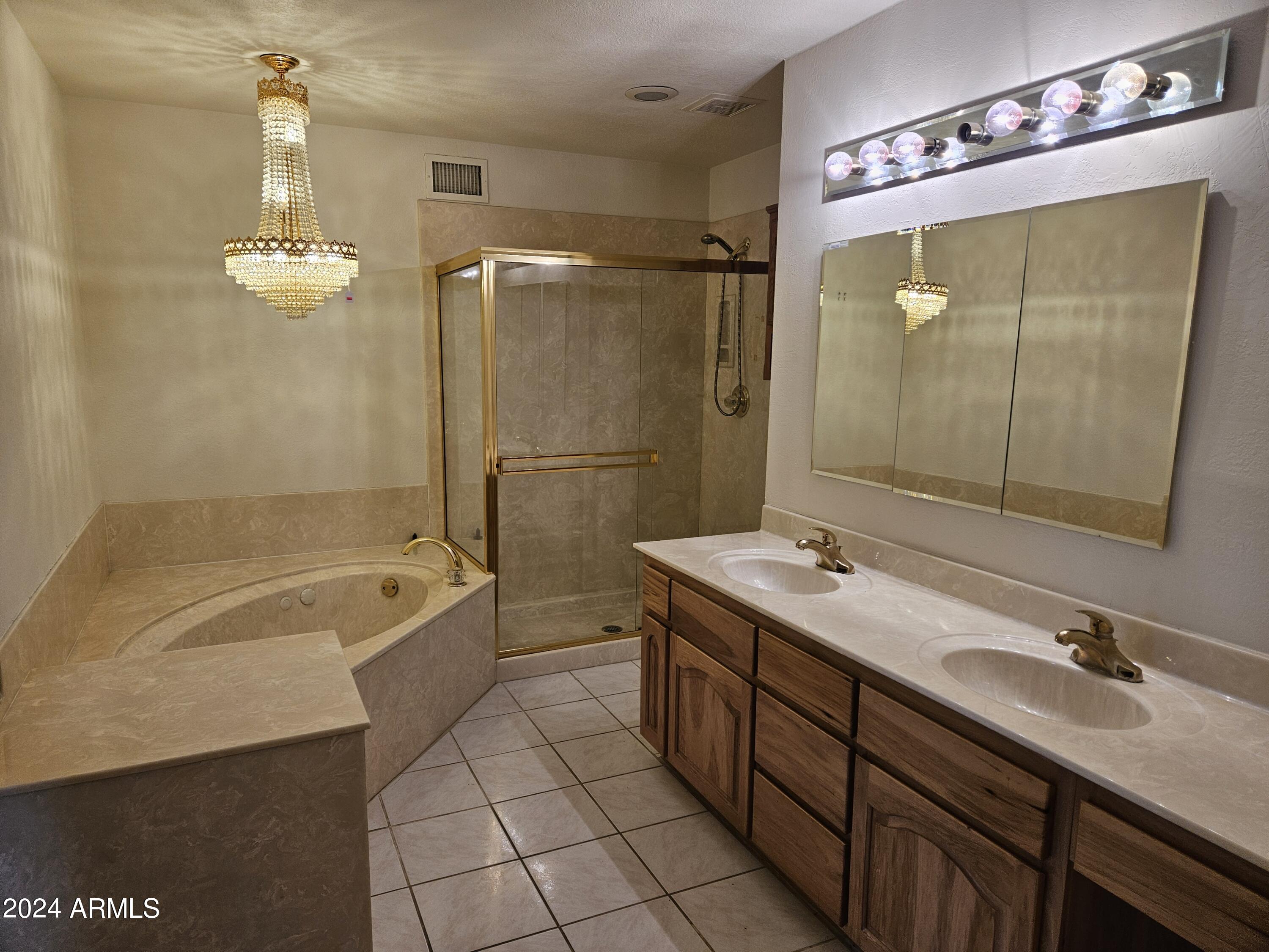 948 East Grandview Road Phoenix, AZ 85022 - Photo 24 of 43 a bathroom with a tub sink shower and mirror