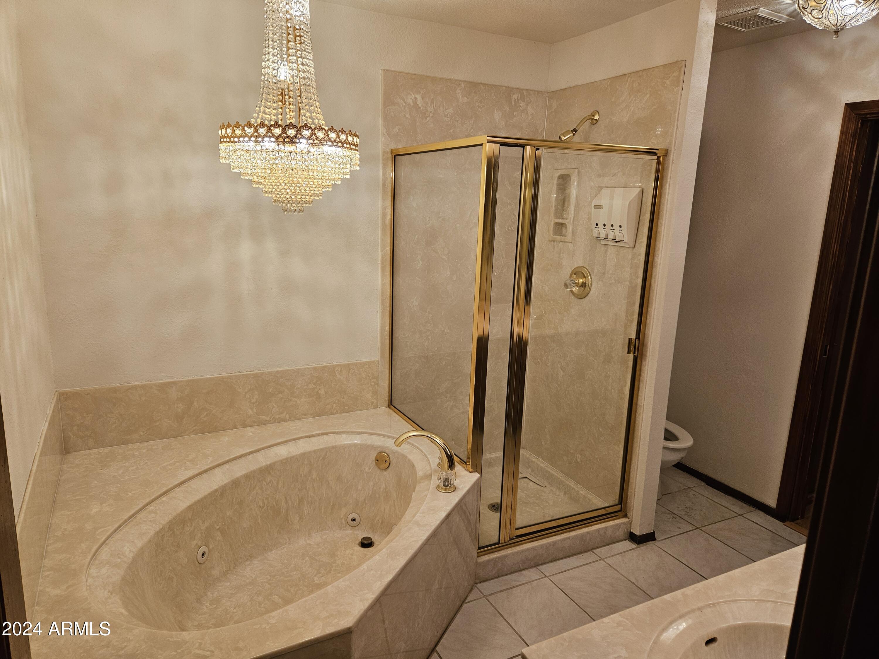 948 East Grandview Road Phoenix, AZ 85022 - Photo 25 of 43 a bathroom with a tub a mirror and a shower