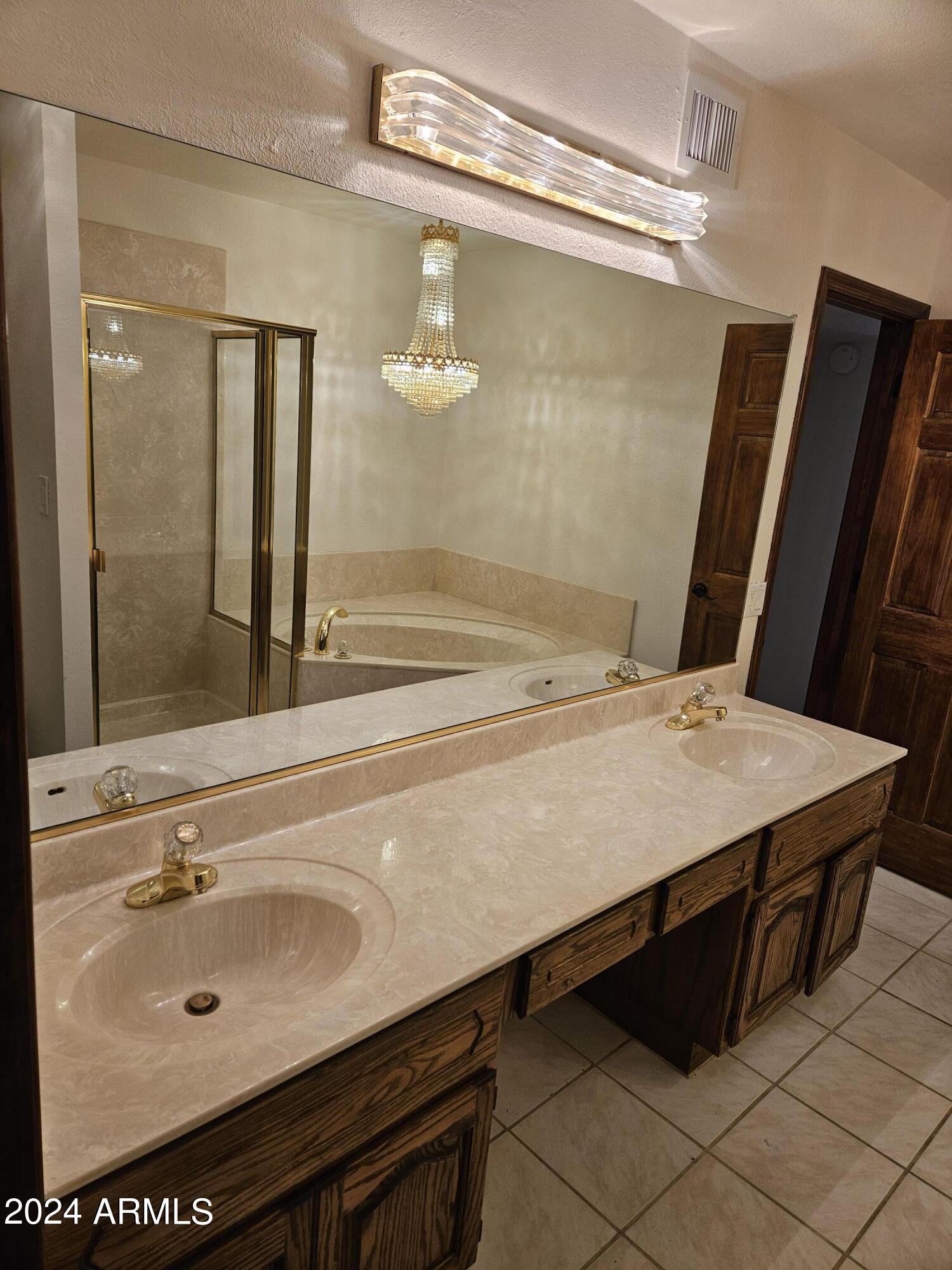 948 East Grandview Road Phoenix, AZ 85022 - Photo 26 of 43 a bathroom with a sink and a mirror