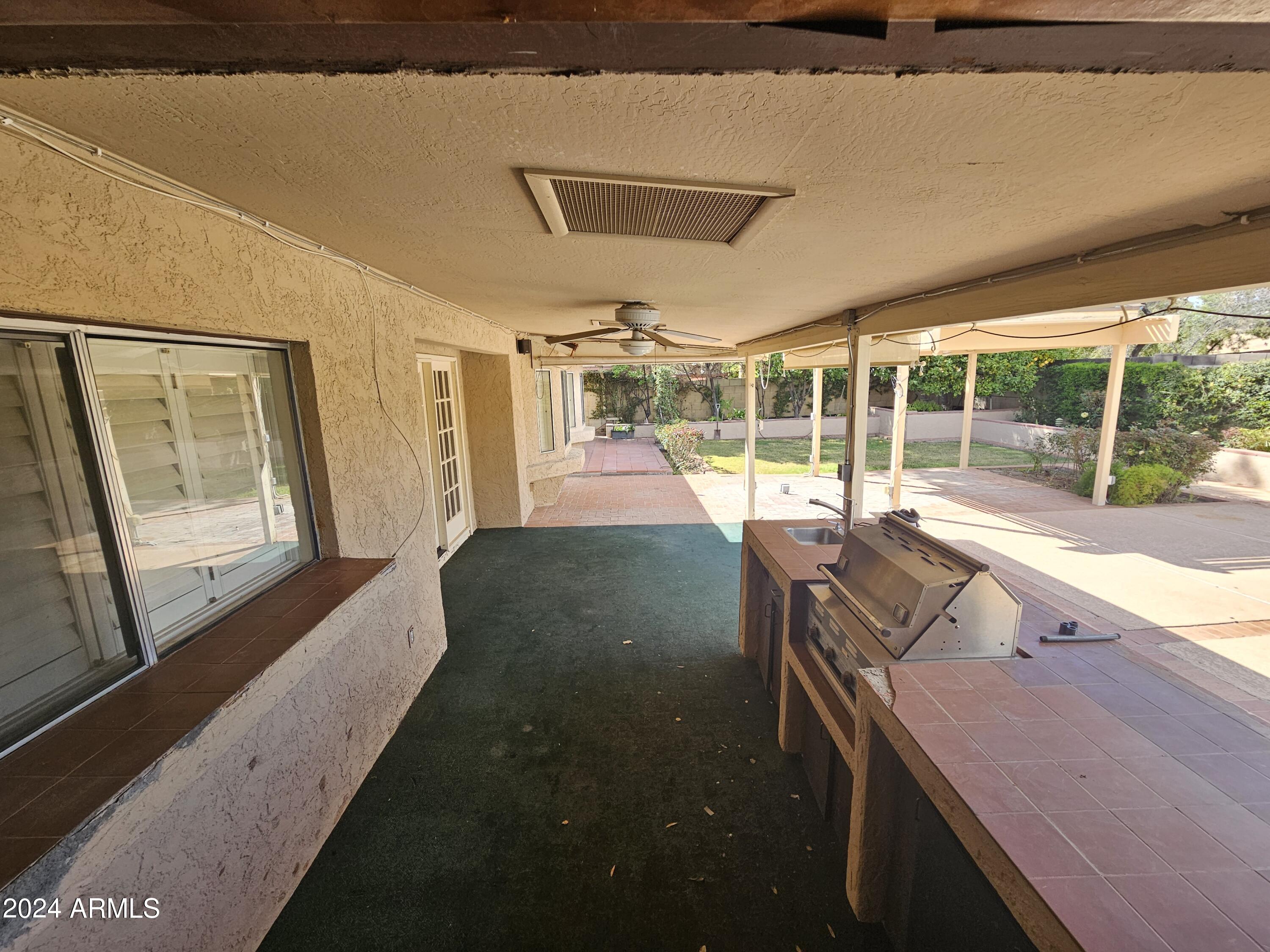 948 East Grandview Road Phoenix, AZ 85022 - Photo 28 of 43 a view of a porch with furniture and garden