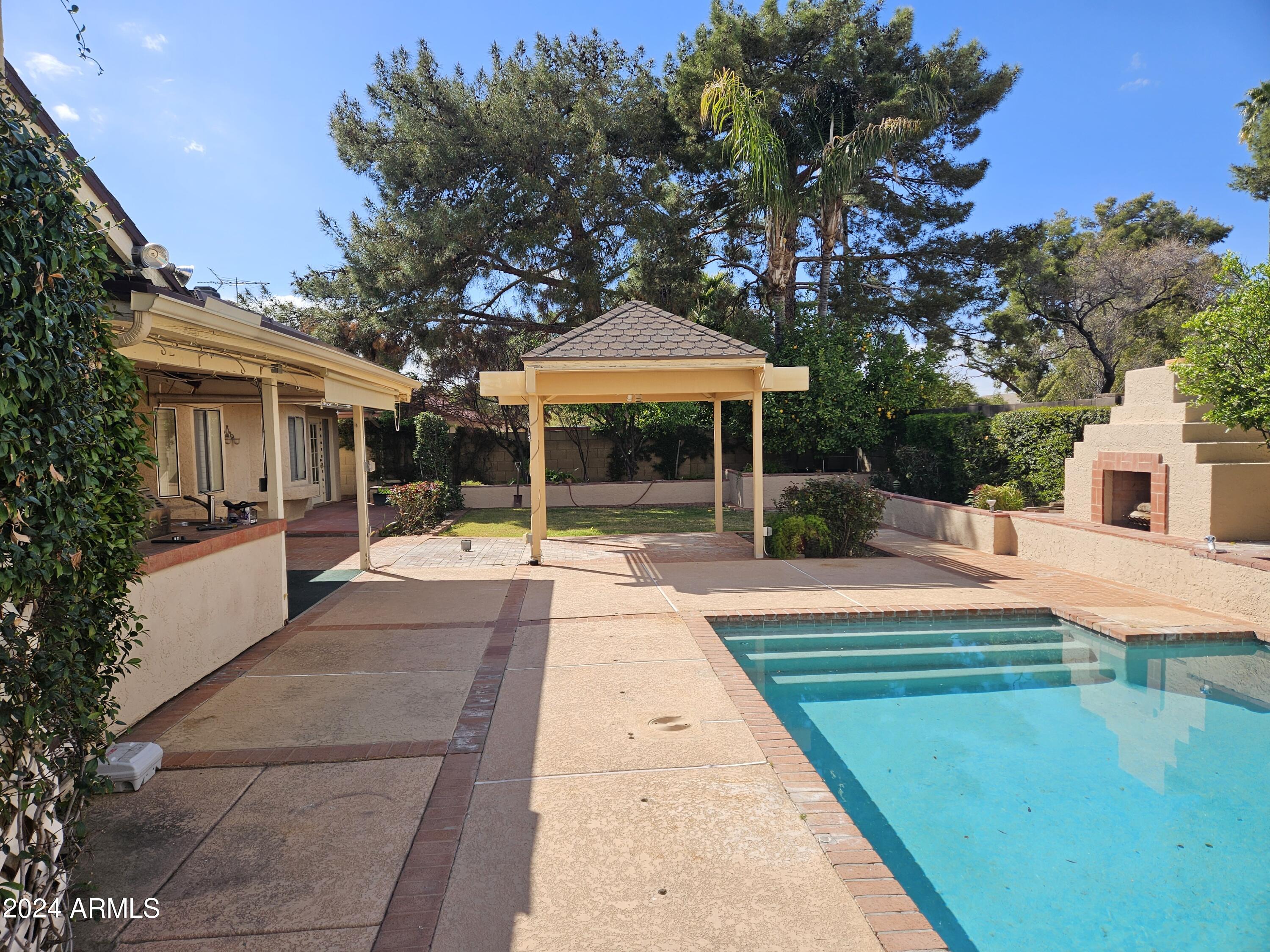 948 East Grandview Road Phoenix, AZ 85022 - Photo 36 of 43 a front view of a house with yard and green space