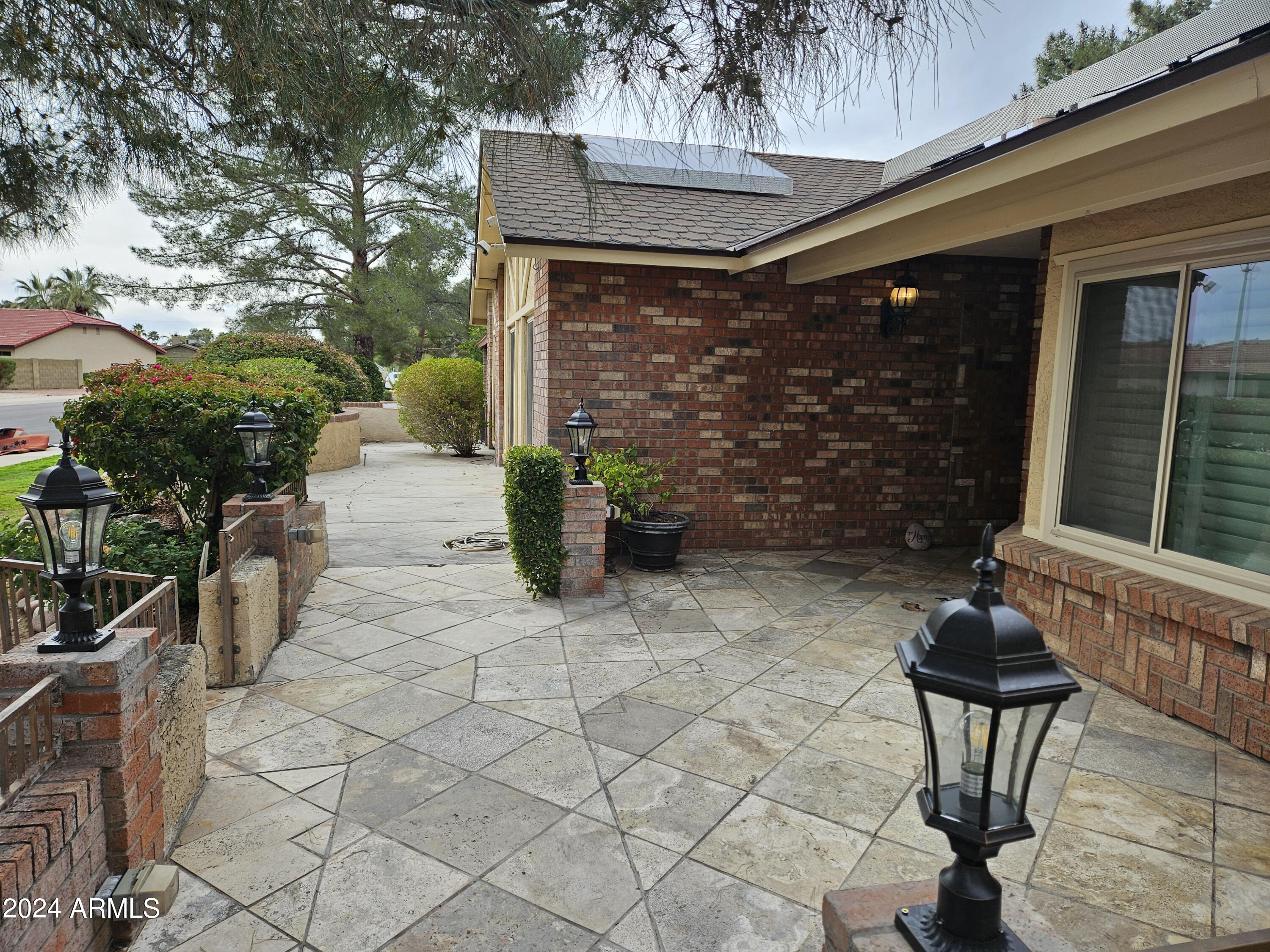 948 East Grandview Road Phoenix, AZ 85022 - Photo 6 of 43 a view of a patio with table and chairs and potted plants