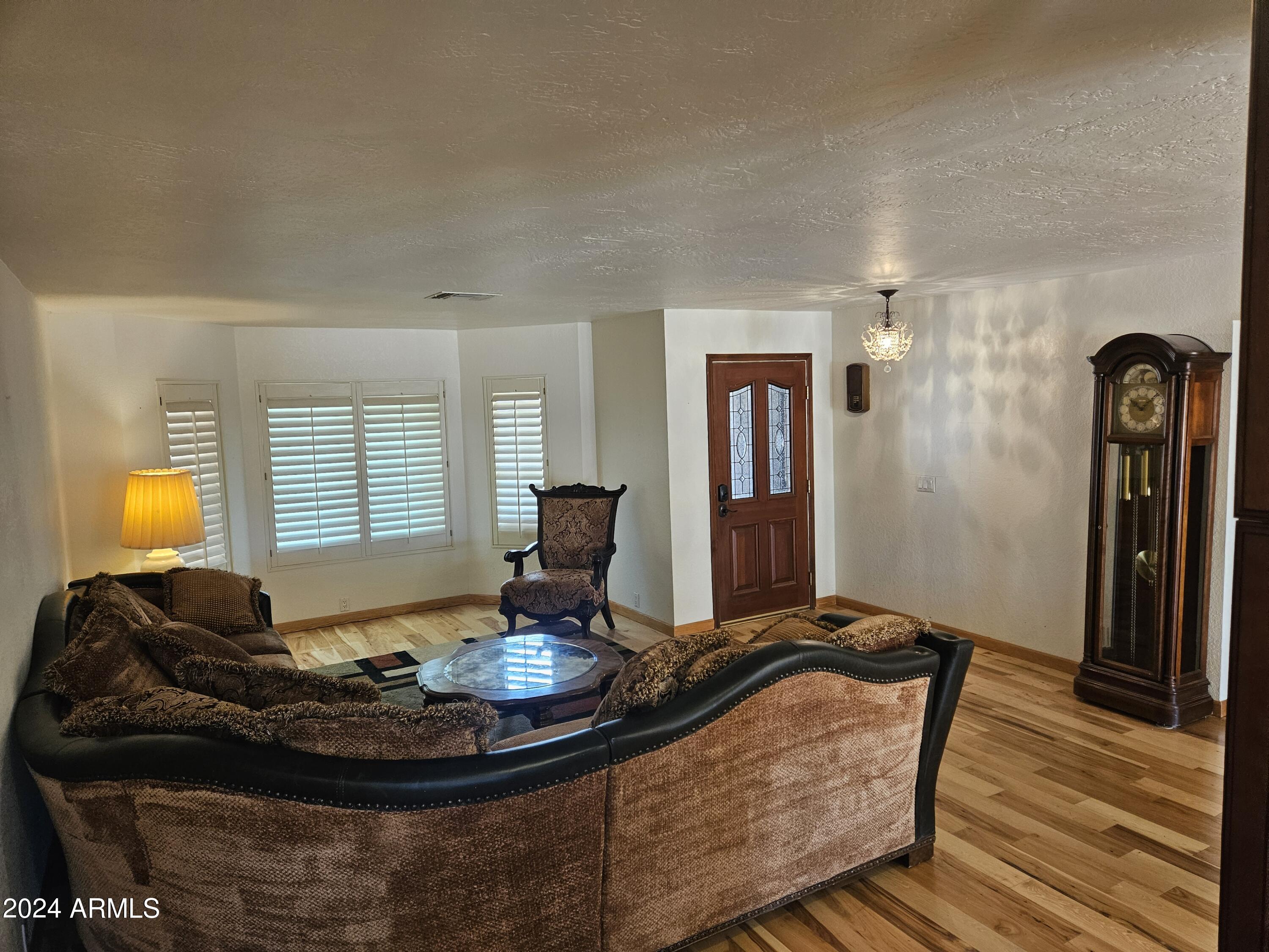 948 East Grandview Road Phoenix, AZ 85022 - Photo 8 of 43 a living room with furniture and wooden floor