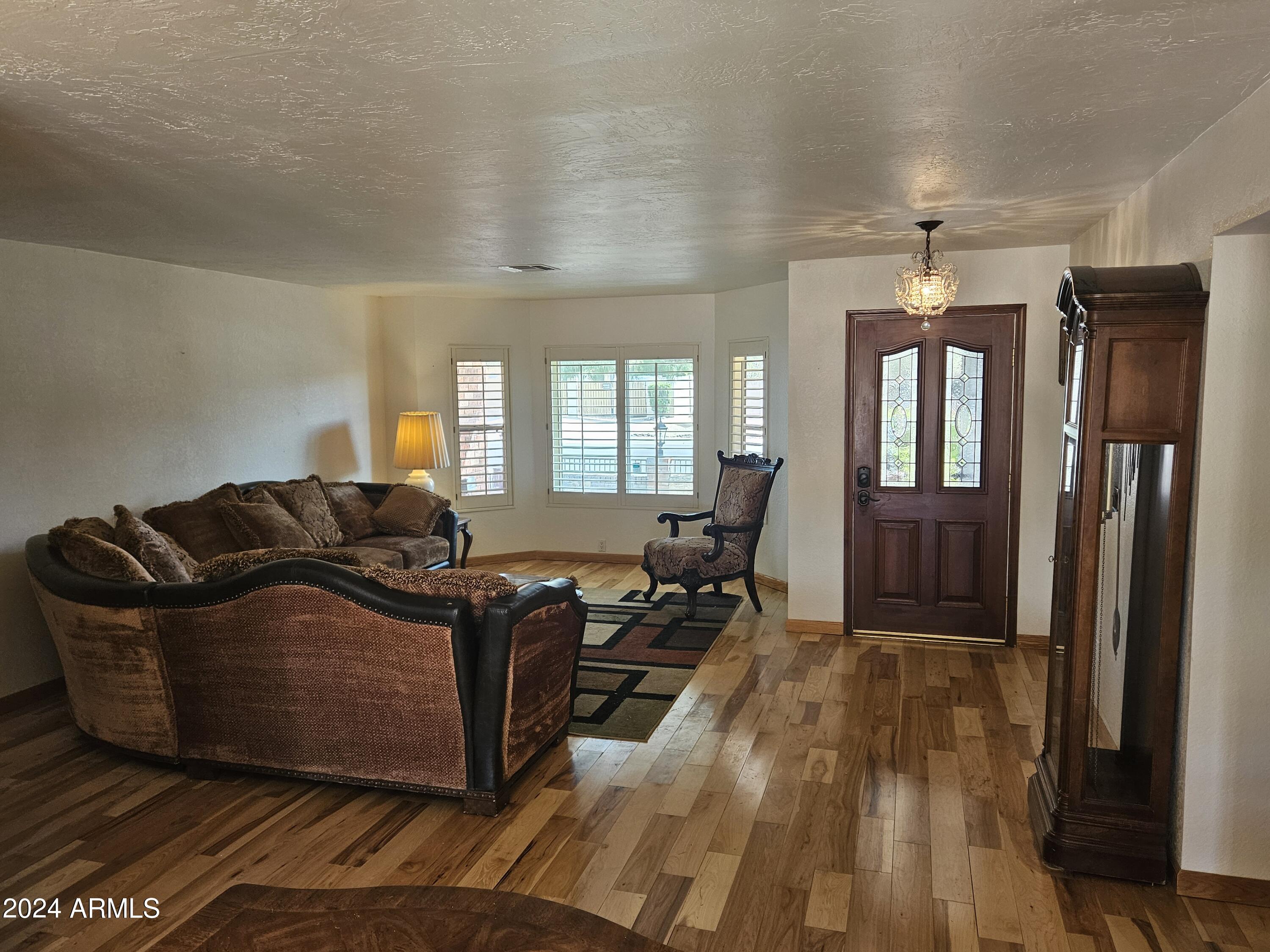 948 East Grandview Road Phoenix, AZ 85022 - Photo 9 of 43 a living room with furniture and a wooden floor