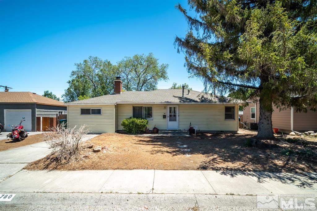780 Stoker Avenue Reno, NV 89503 - Photo 1 of 25 a front view of a house with a yard