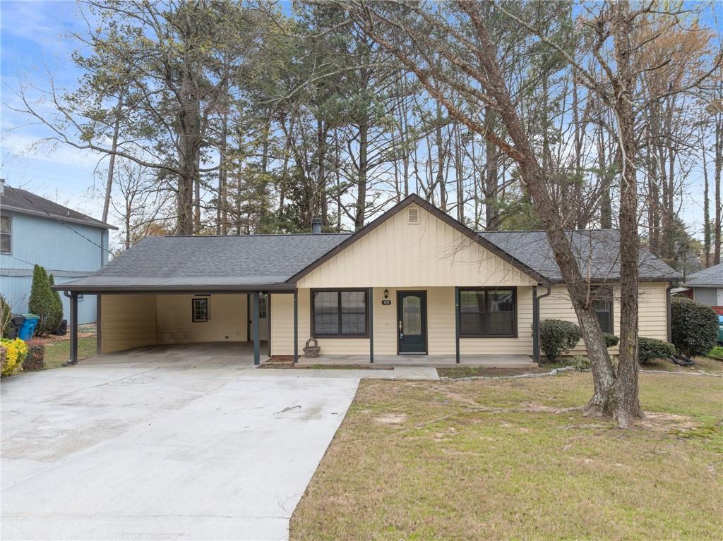 4578 Simpson Mill Lane Northwest Duluth, GA 30096 - Photo 1 of 1 a front view of a house with a yard