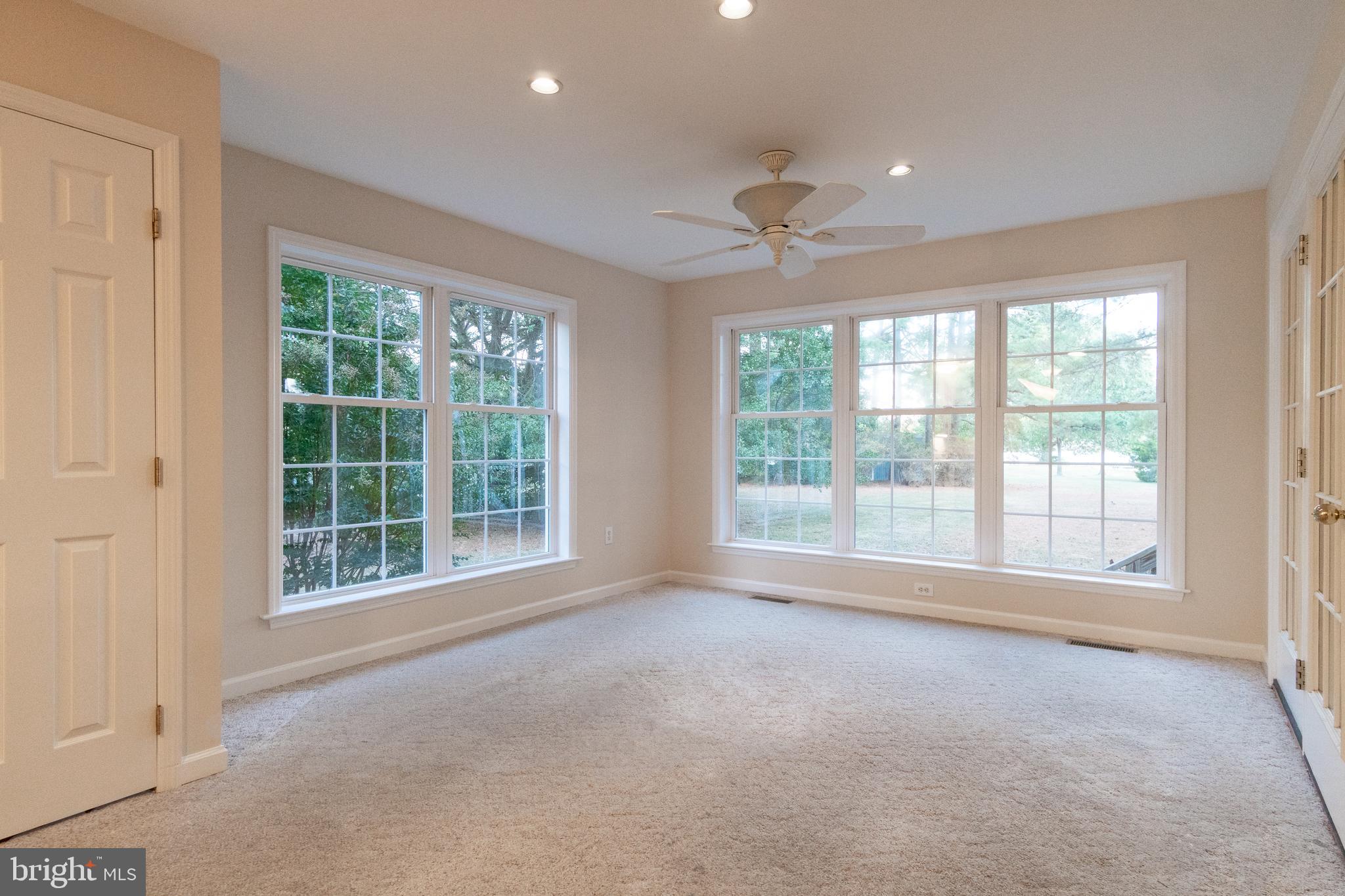 49701 Airedele Road Ridge, MD 20680 - Photo 18 of 53 Floor to ceiling windows in the dining room