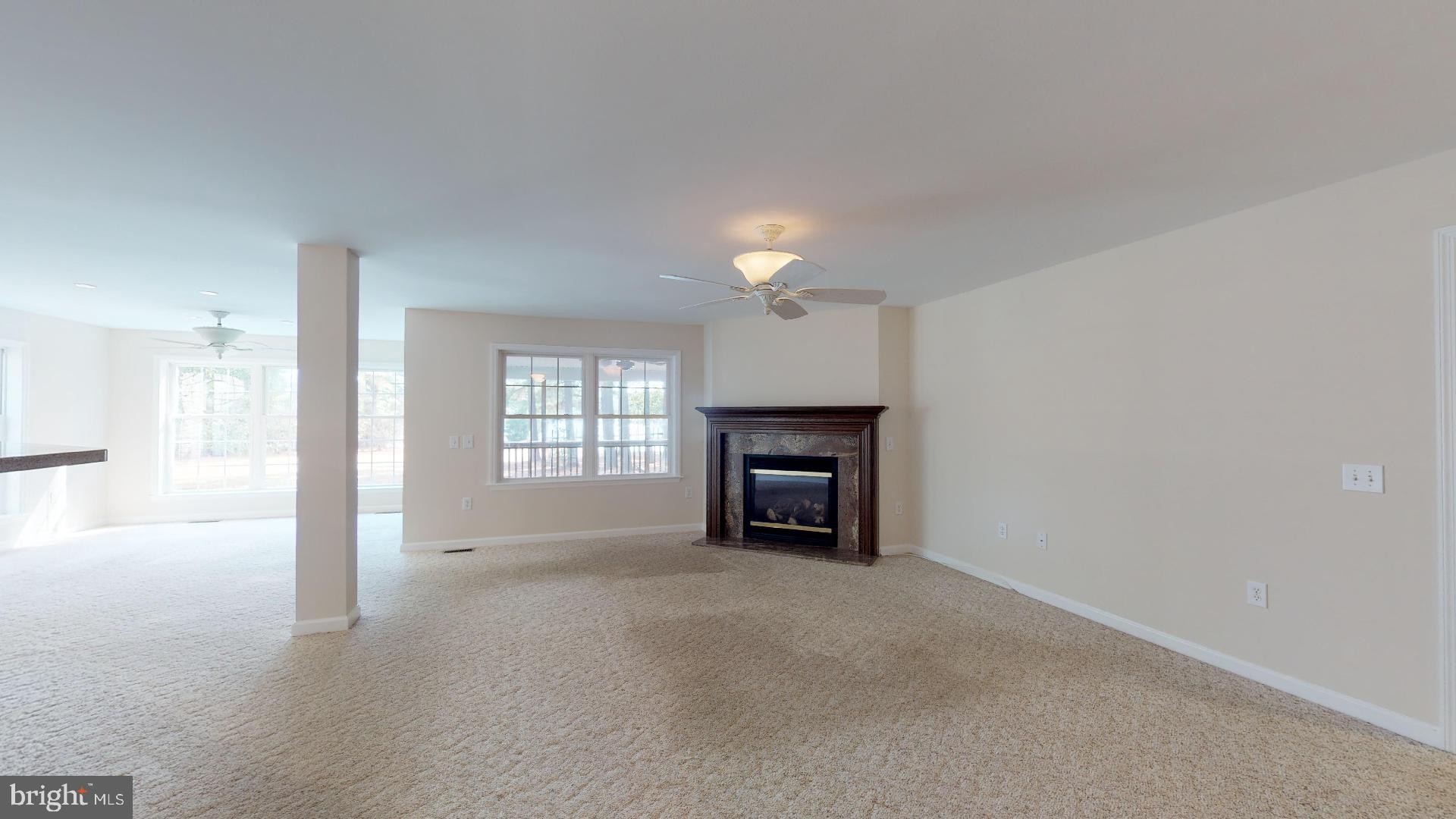 49701 Airedele Road Ridge, MD 20680 - Photo 19 of 53 Large open living room with fireplace